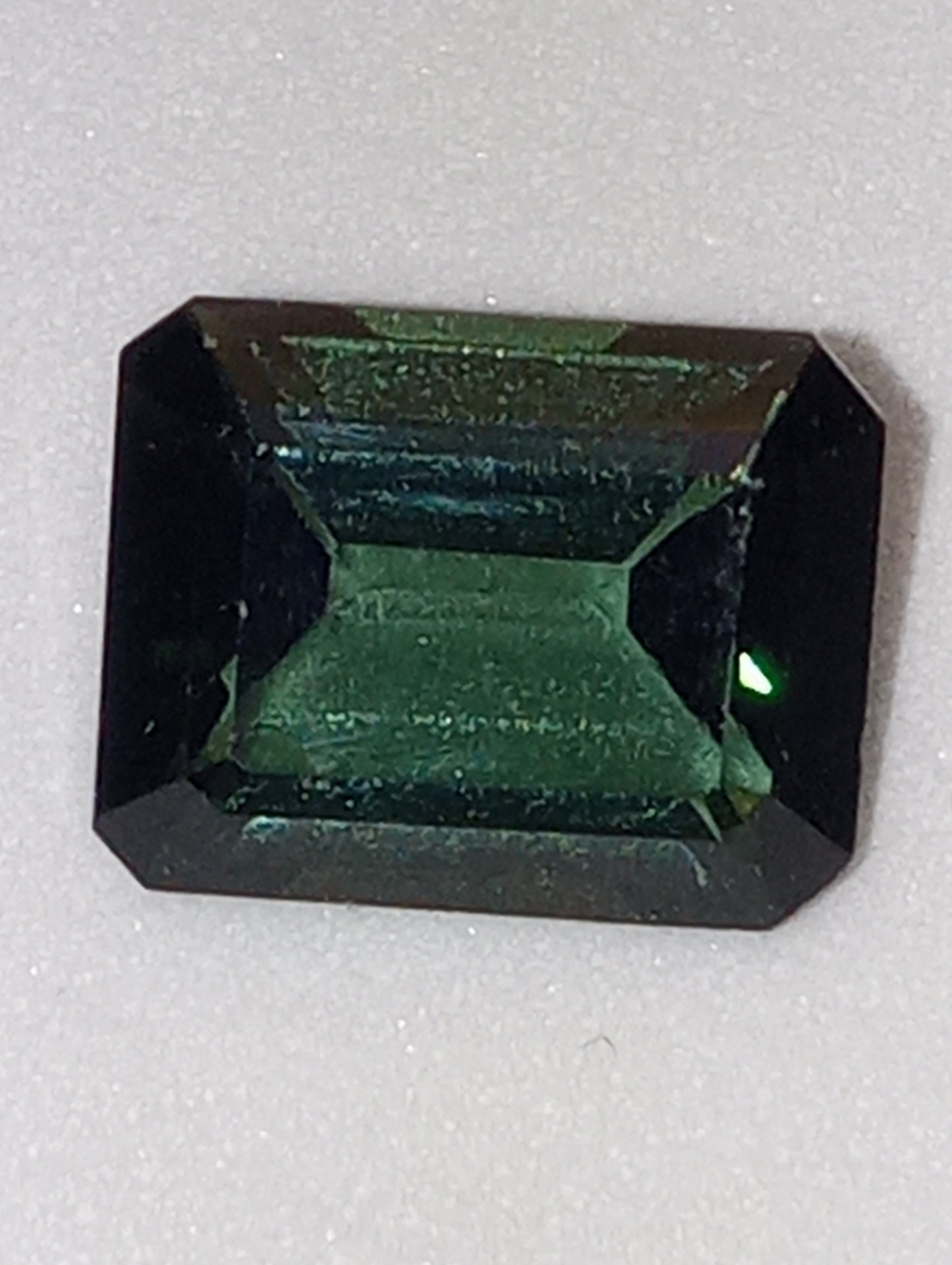 tourmaline gemstone bluish-green emerald cut 9mmx7mm