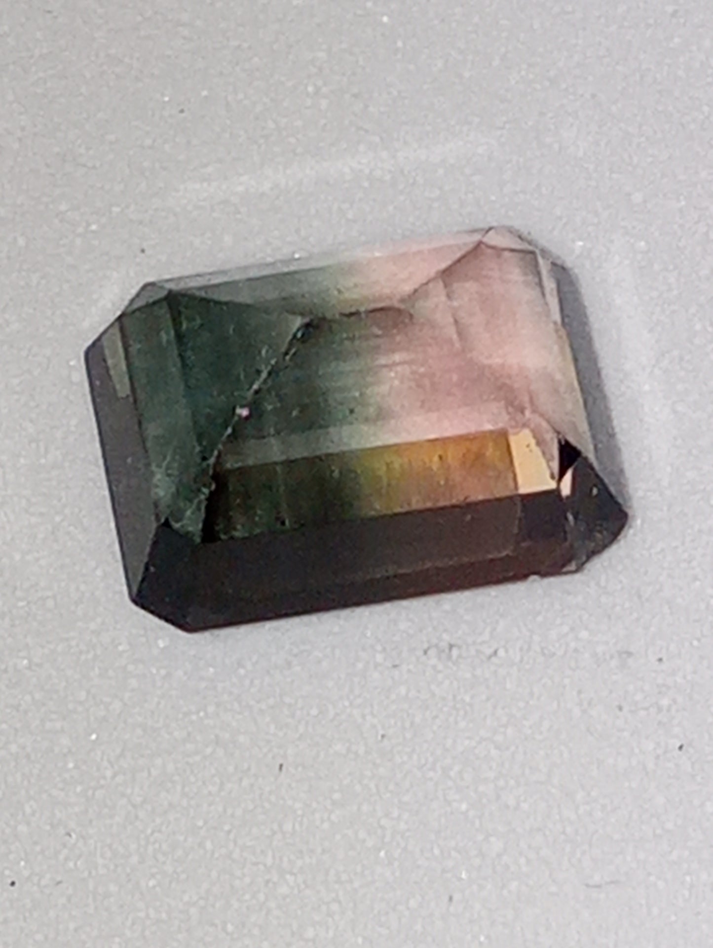 tourmaline gemstone bi-colored emerald cut 9mmx7mm