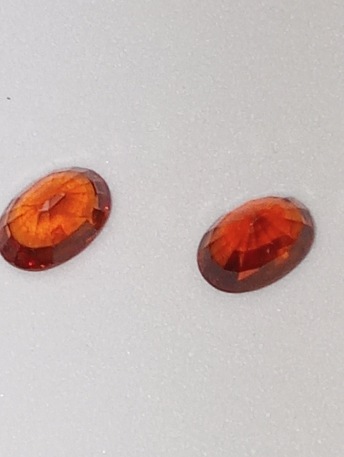 garnet gemstones spessartite, 6mmx4mm ovals, 2 stones