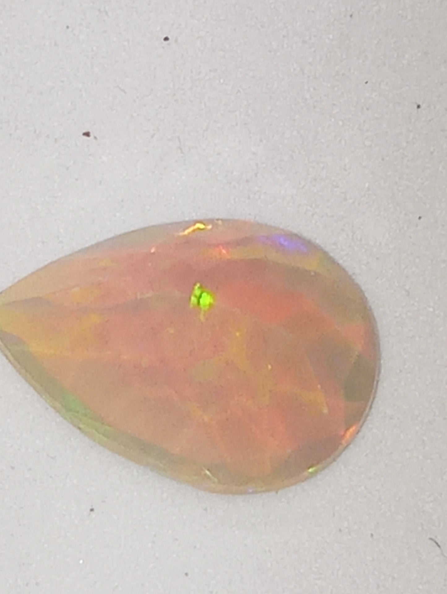 opal Ethiopian gemstone, pear shape, 14mmx10mm, green flash faceted