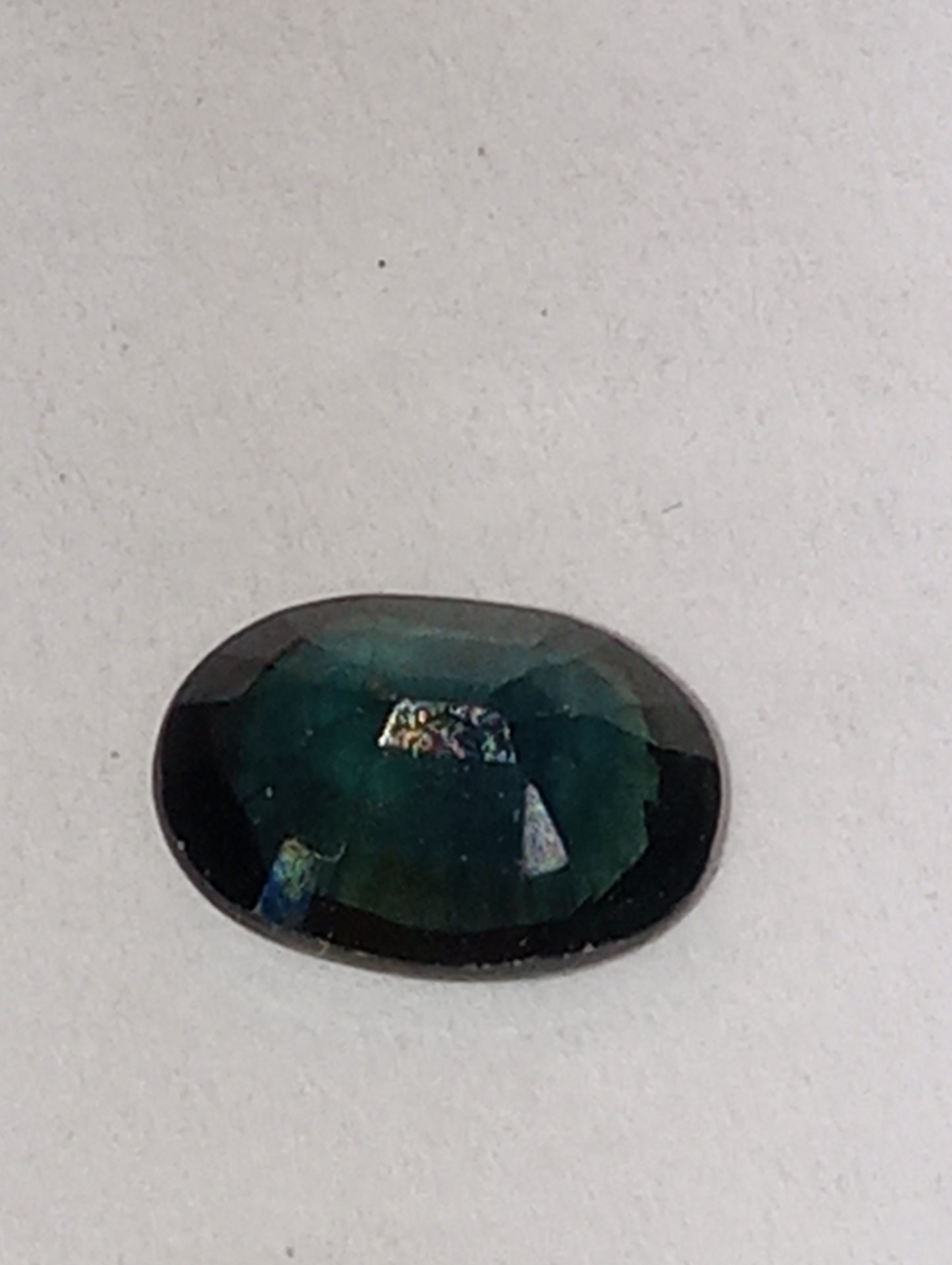 sapphire gemstone teal. 7mmx5mm oval cut, .81ct