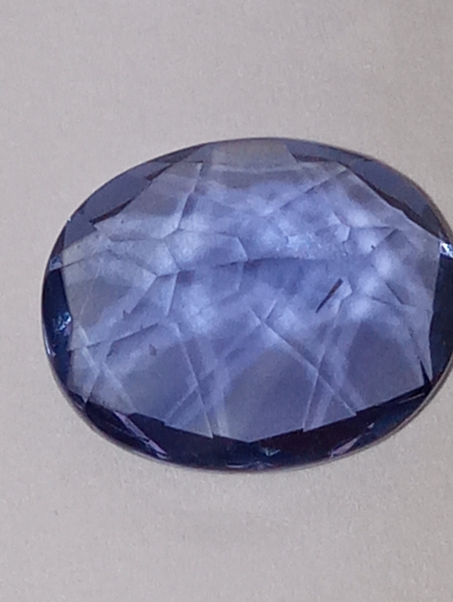 fluorite gemstone, blue-purple color shift, 11mmx9mm oval cut, 4.04ct
