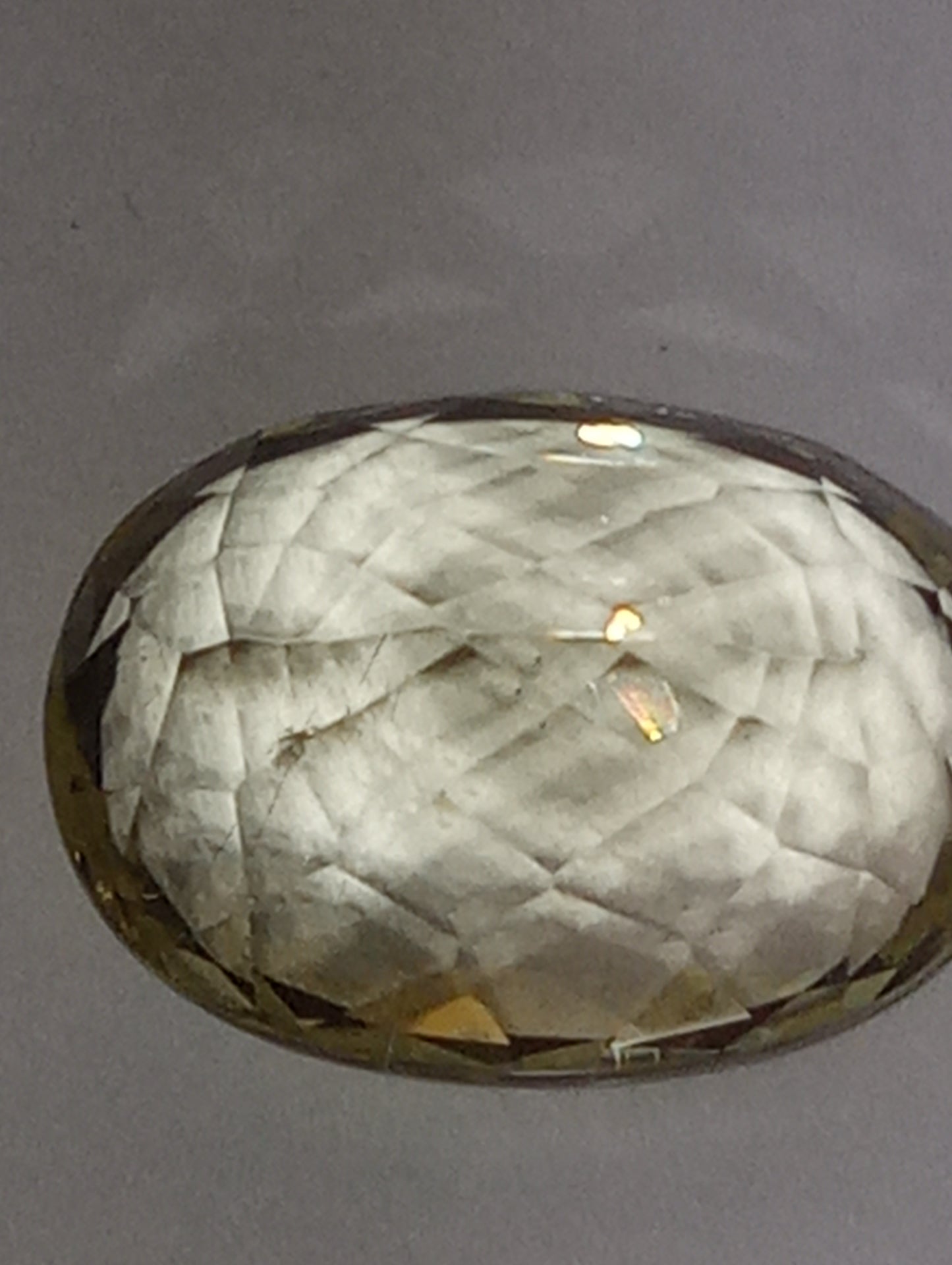 Teradora (TM) gemstone, yellow, 14x10mm oval cut, 8.43ct