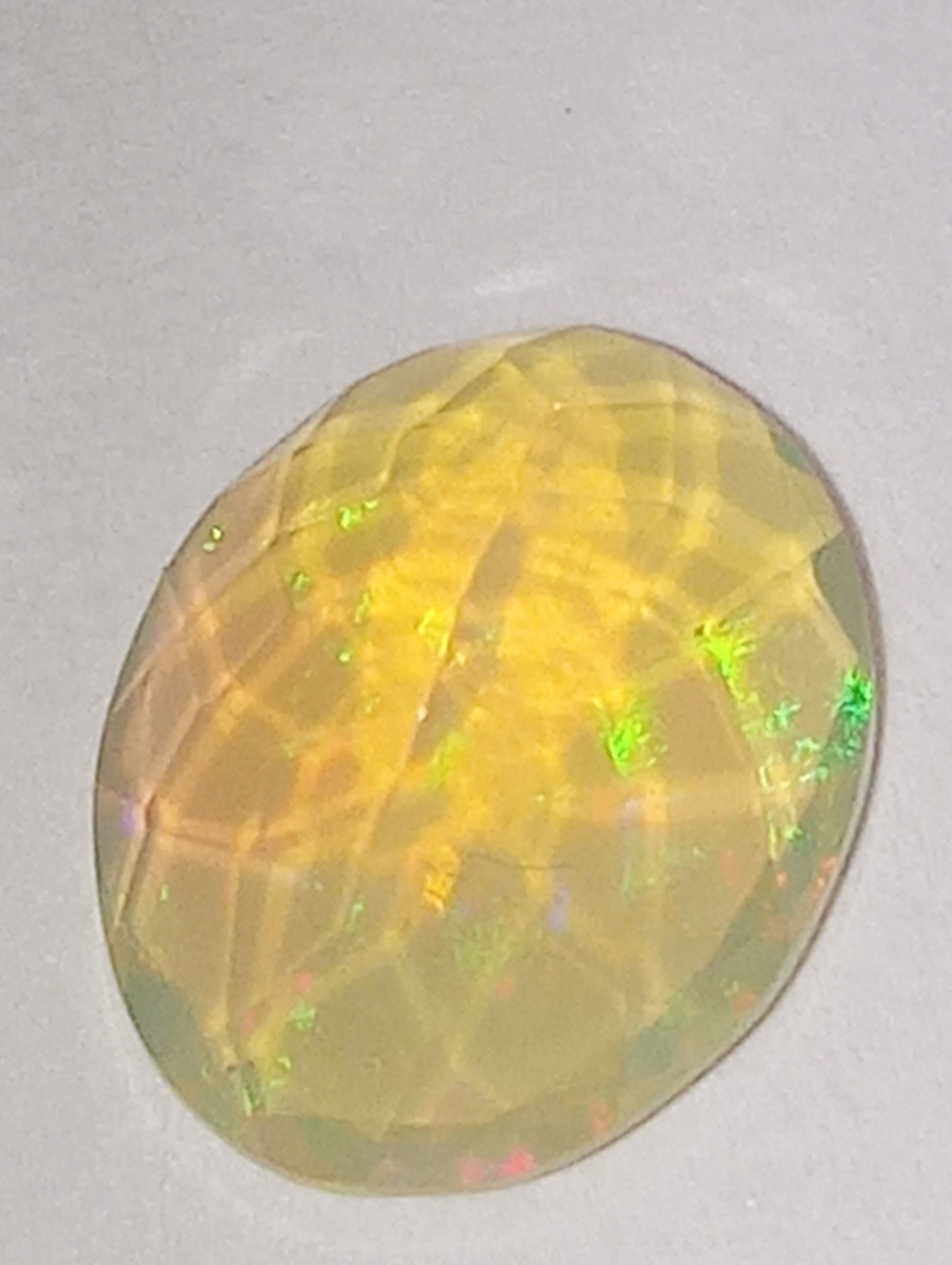 opal gemstone Ethiopian faceted 10mmx8mm oval cut, 1.32ct