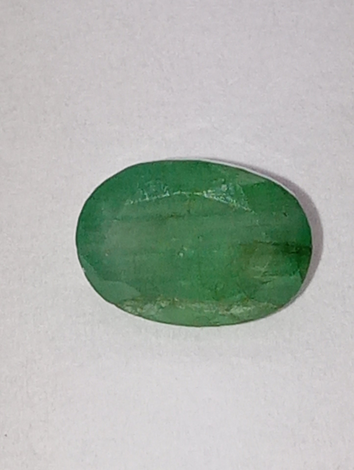 emerald gemstone, 7mmx5mm oval cut, .92ct