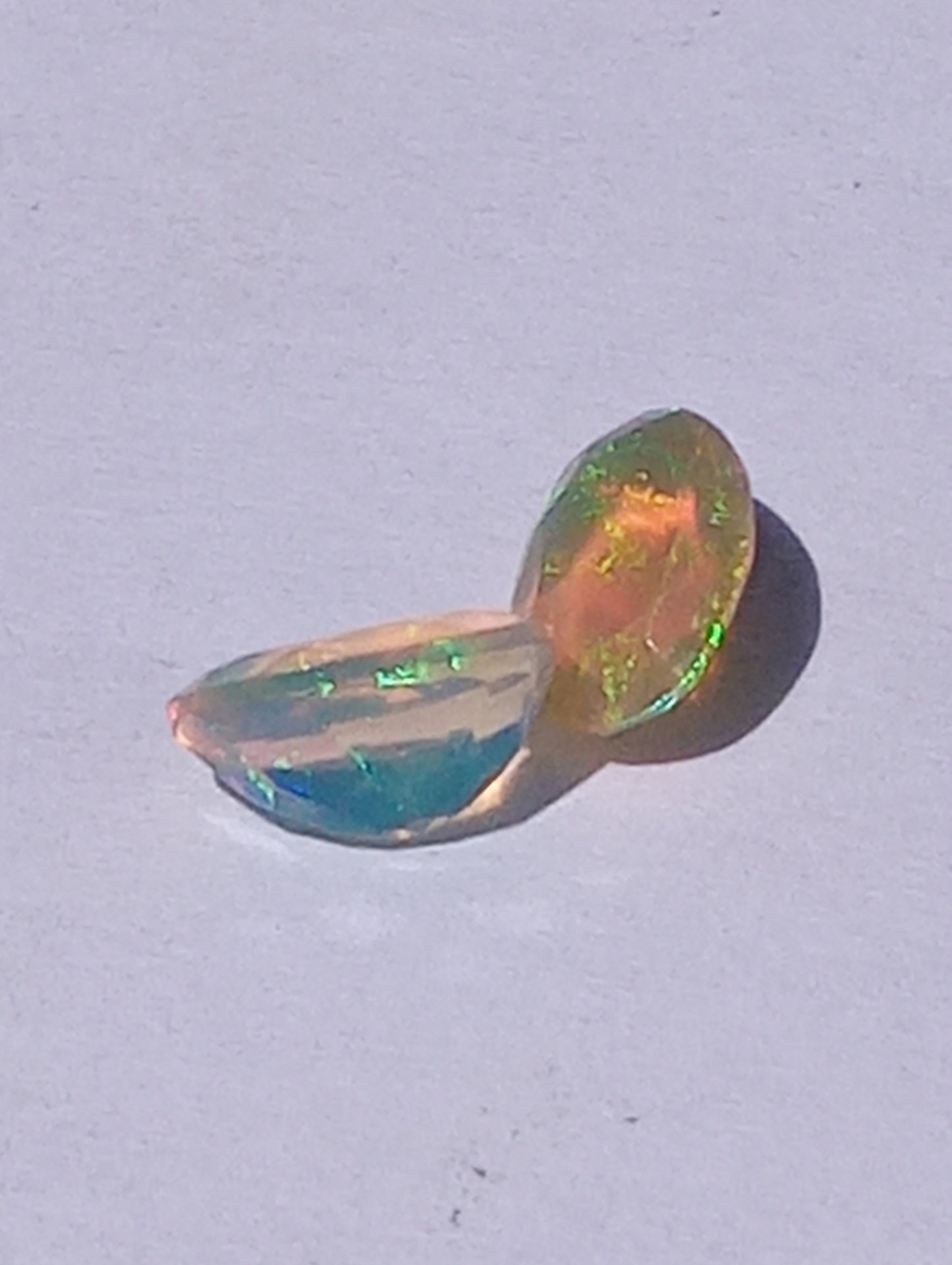 opal gemstone Ethiopian, 7mmx5mm faceted, oval cuts, 2 stones, .91ctw
