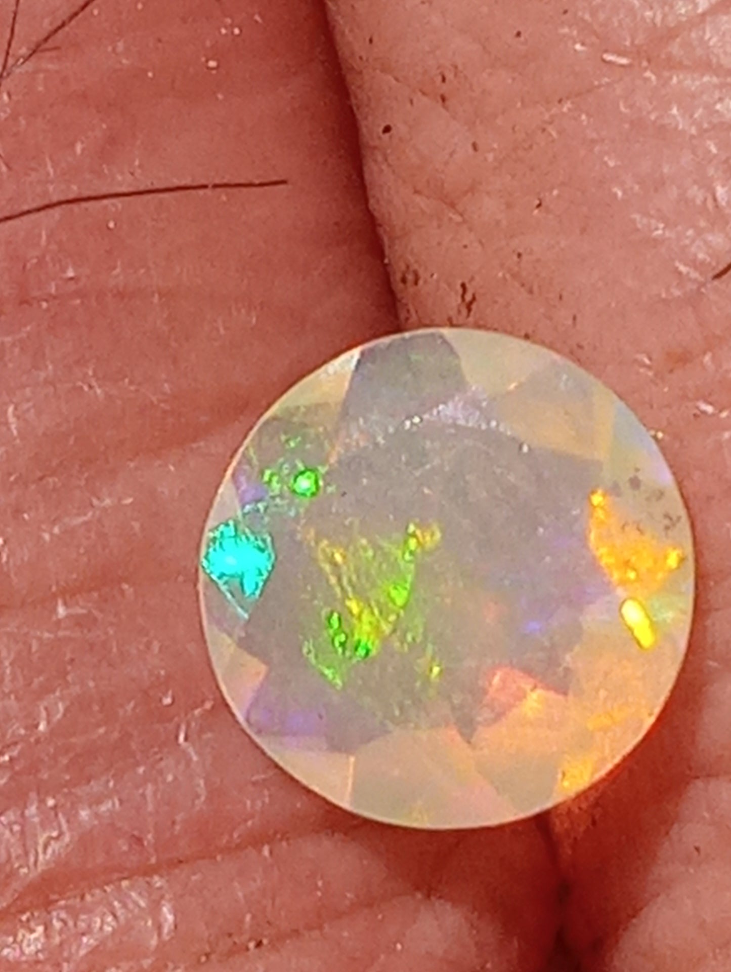 opal gemstone Ethiopian, faceted 7mm round cut, .61ct