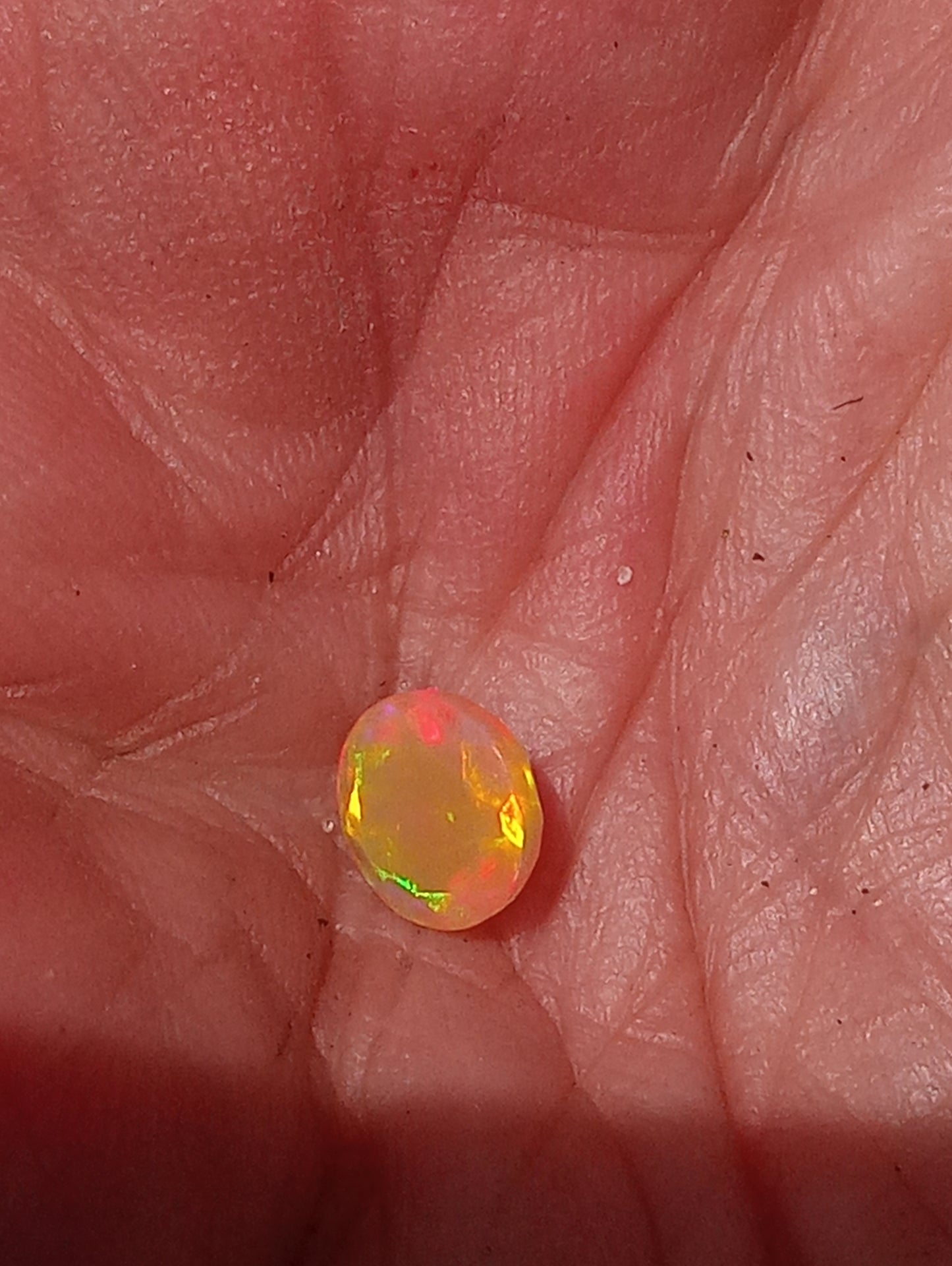 opal gemstone Ethiopian, faceted 7mm round cut, .79ct