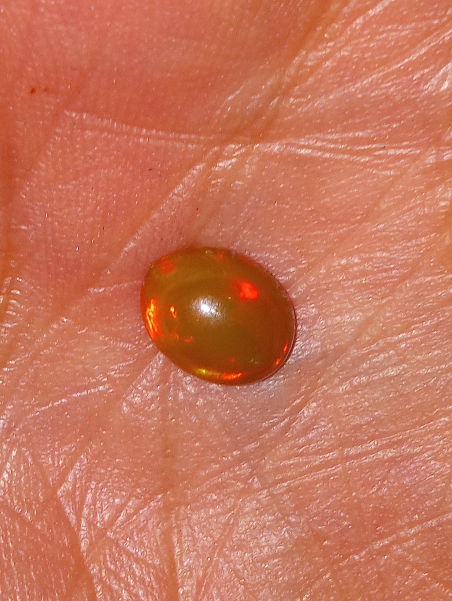 opal gemstone Ethiopian 9mmx7mm oval cab, 1.50ct
