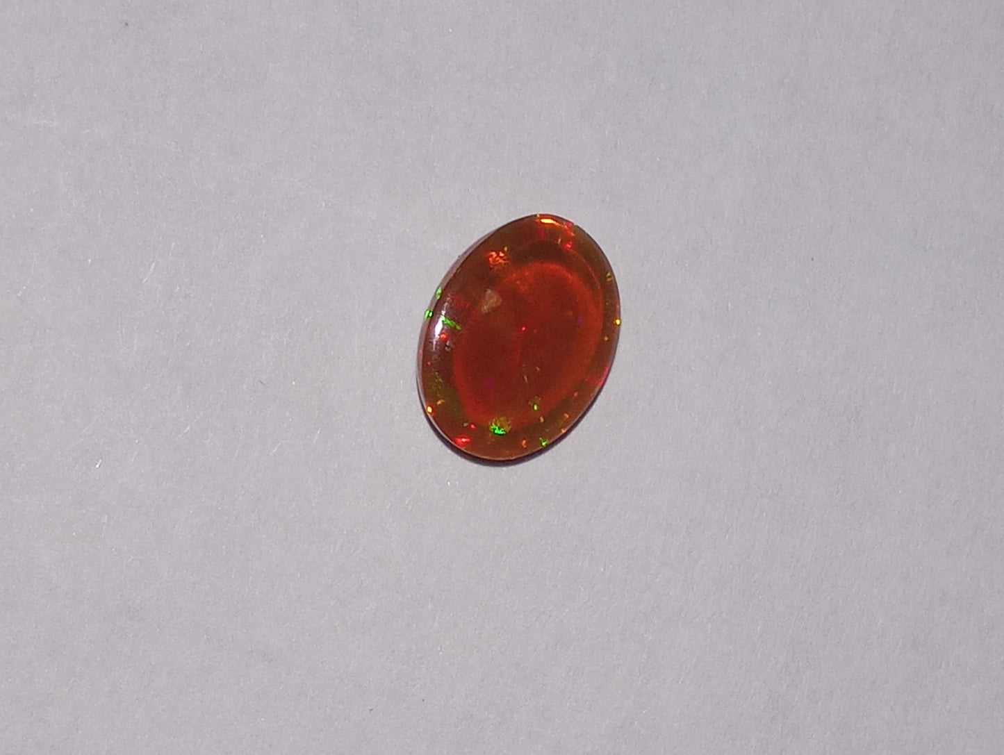 opal gemstone Ethiopian, 9mmx7mm oval cabacon, 1.24ct