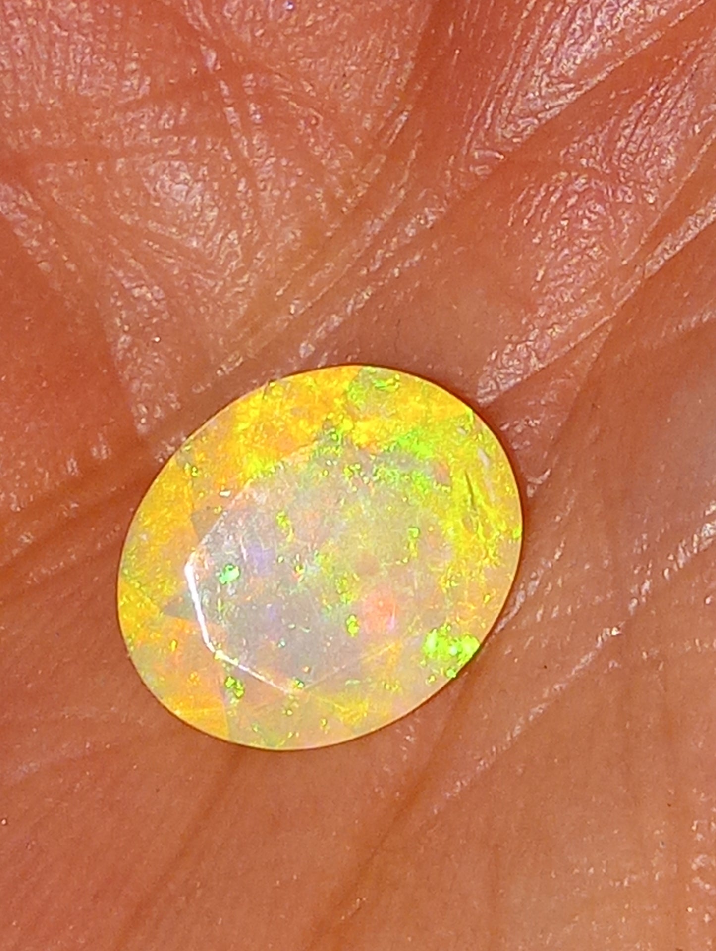opal gemstone Ethiopian, faceted, 11mmx9mm oval cut, 1.94ct