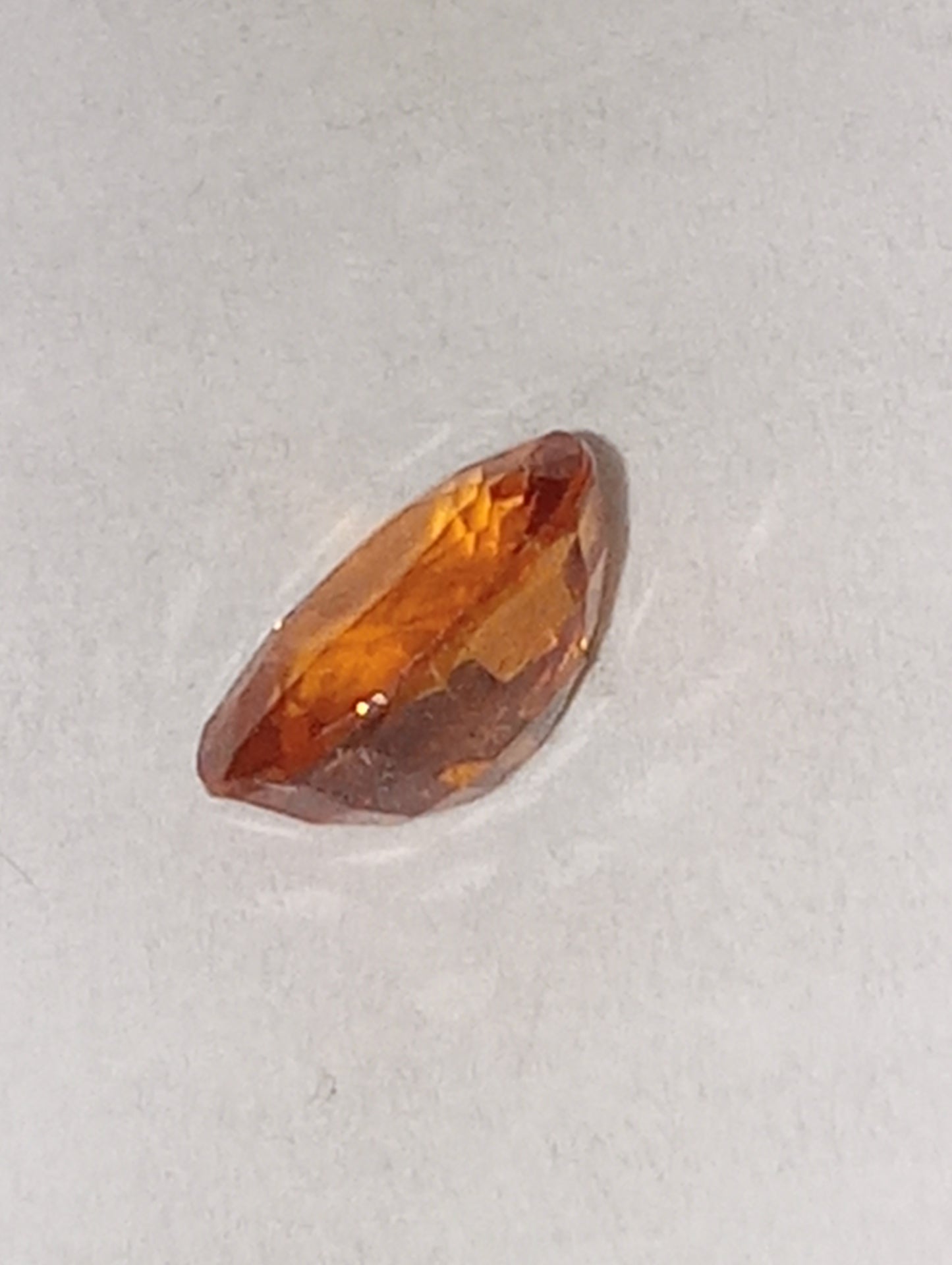 garnet gemstone spessartite, 6mmx4mm oval cut, .70ct