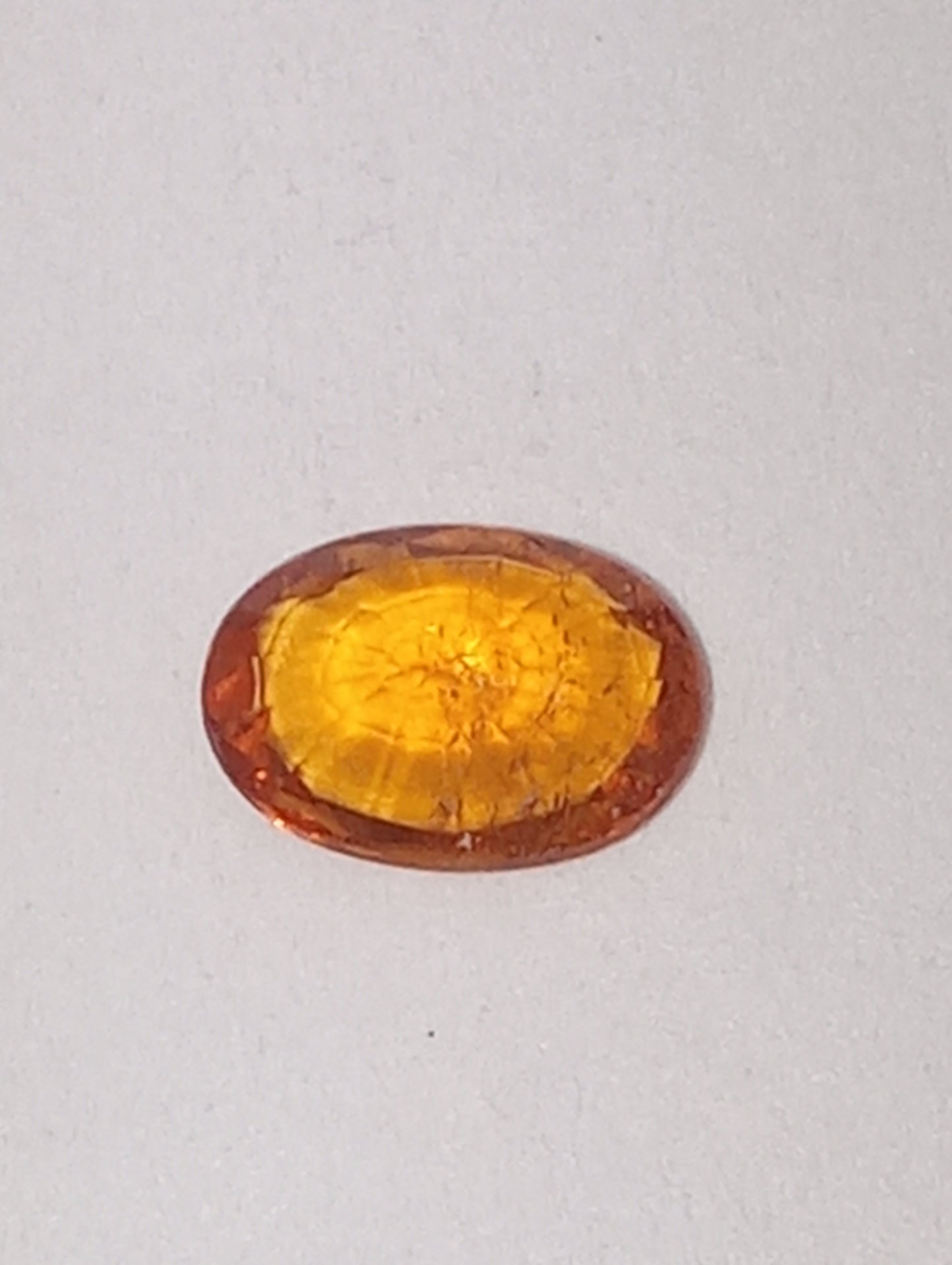 garnet gemstone mandarin spessartite, 6mmx4mm oval cut, .60ct