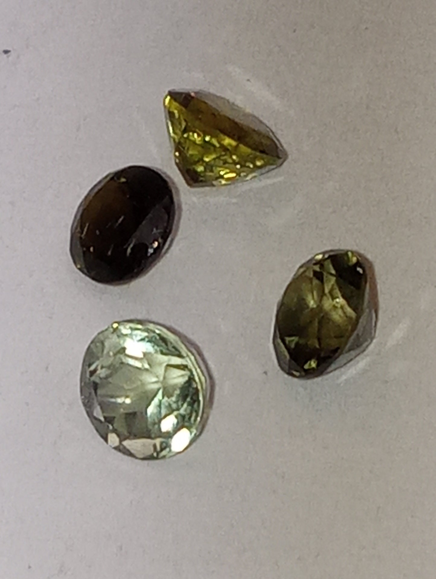 tourmaline gemstones, green shades, 5mm round cuts, 4 stones, 2.20ctw