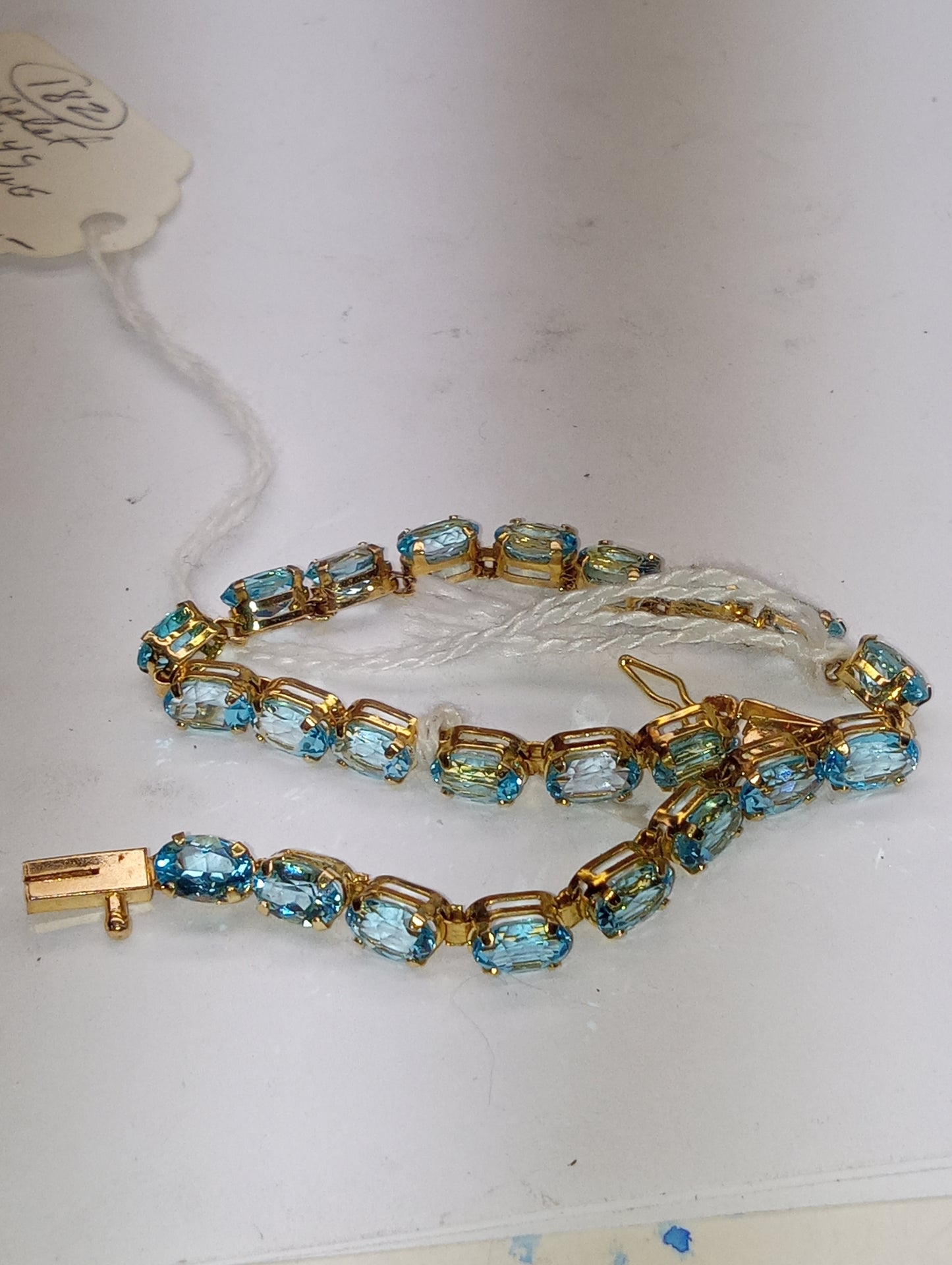 bracelet Swiss blue topaz 6mmx4mm ovals in 14k yellow gold