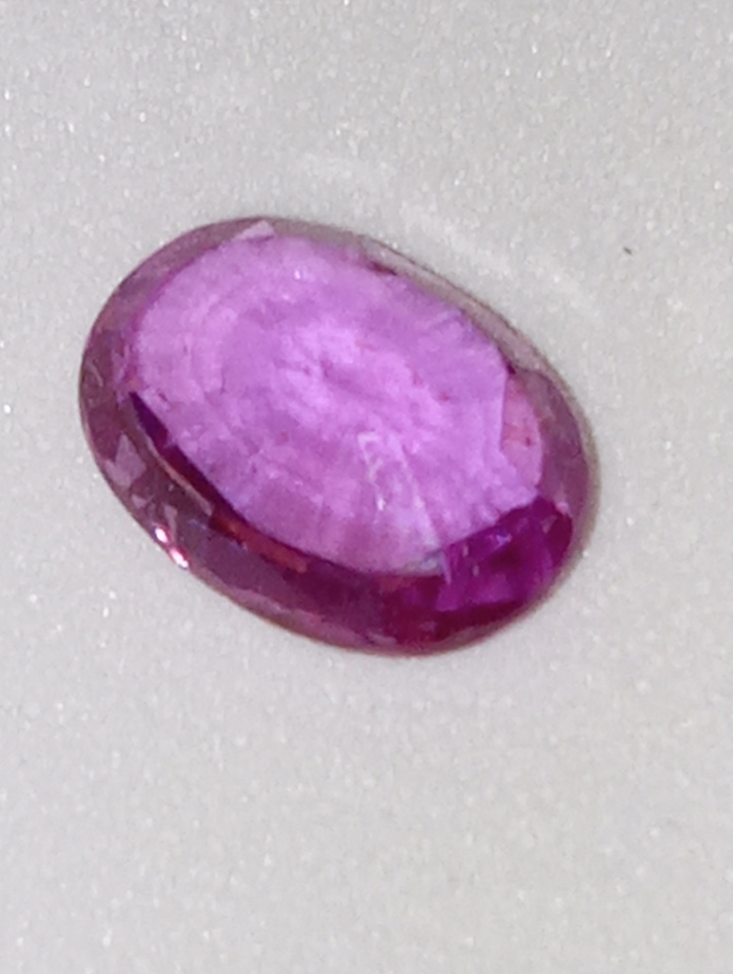 sapphire gemstone, pinky-purple,  7x5mm oval .92ct