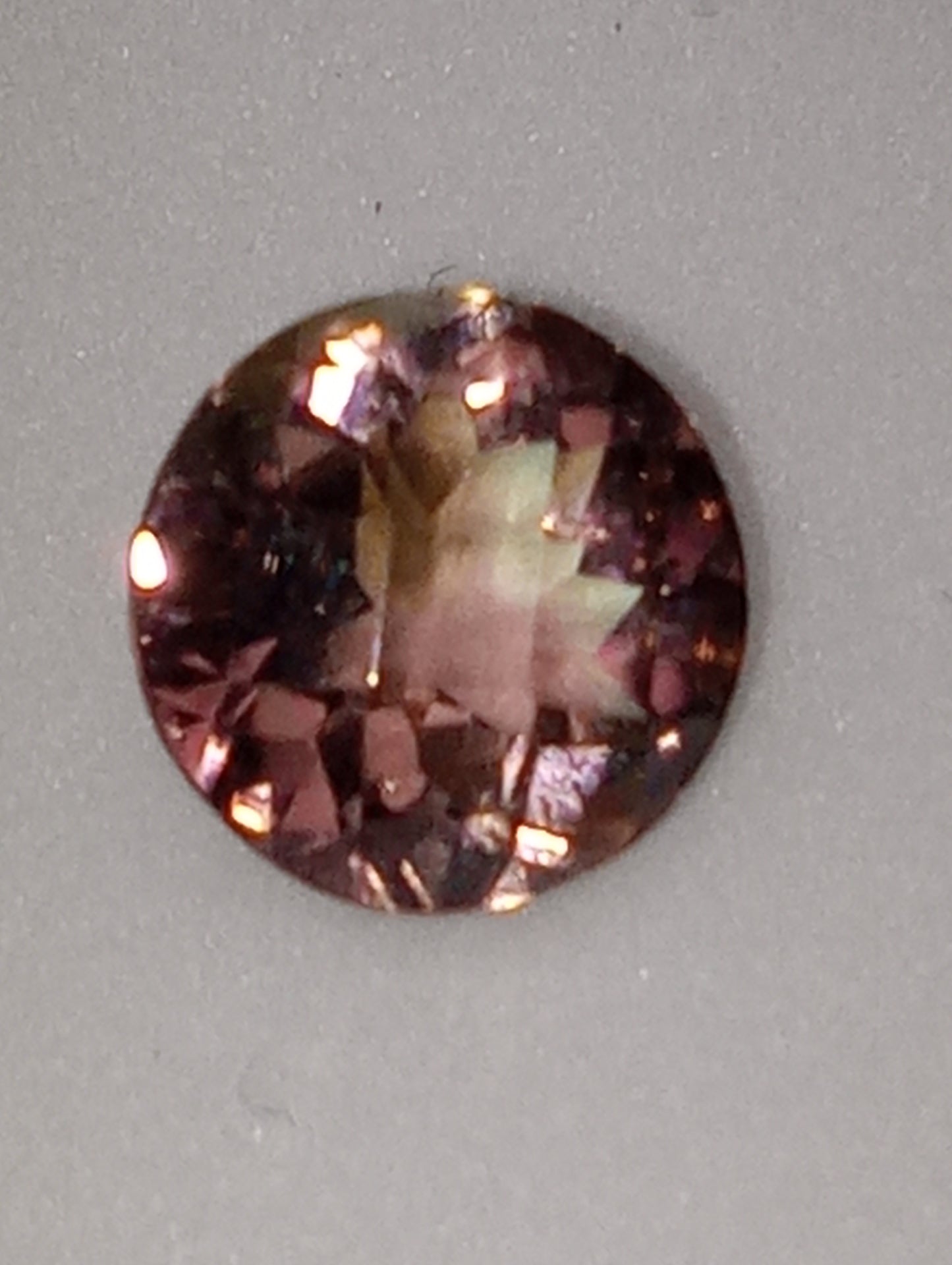 tourmaline gemstone bi-colored , round cut