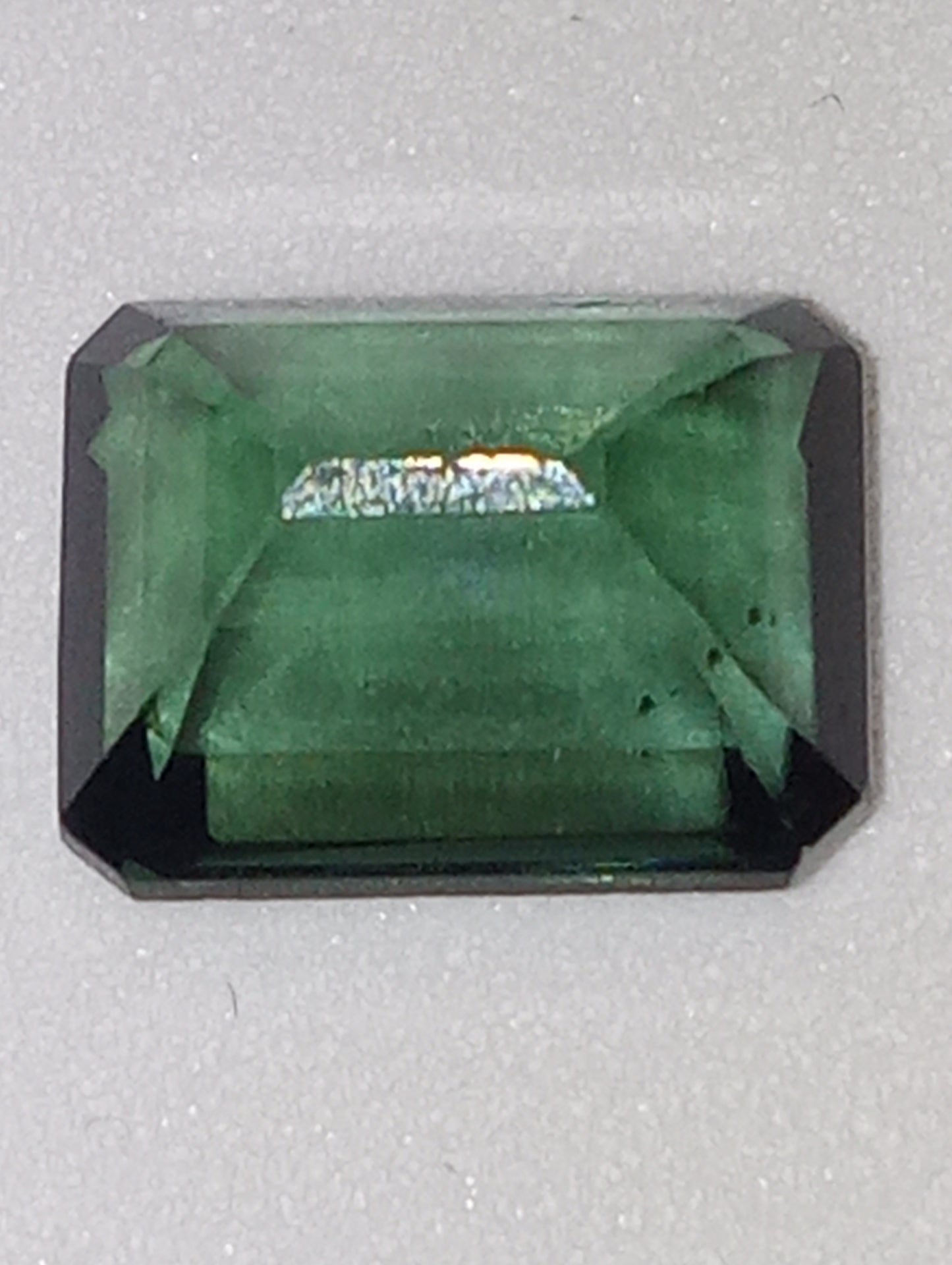 tourmaline gemstone bluish-green emerald cut 9mmx7mm