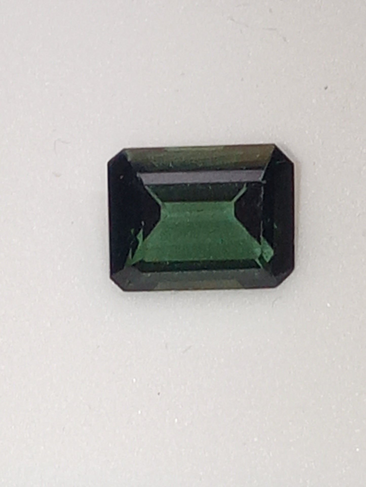 tourmaline gemstone bluish-green emerald cut 9mmx7mm