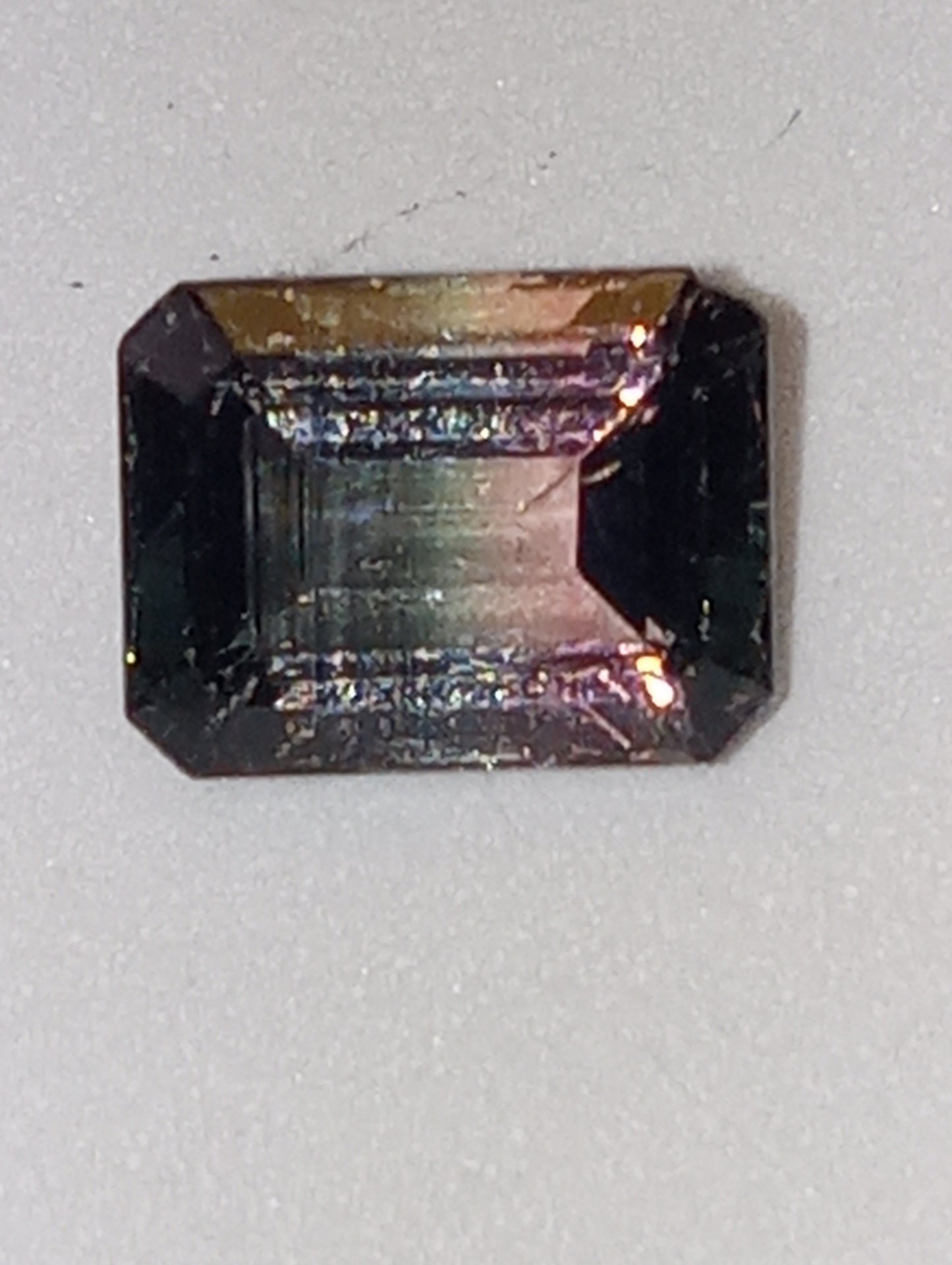tourmaline gemstone bi-colored emerald cut 9mmx7mm