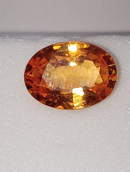 garnet gemstone  mandarin spessartite,  7mmx5mm oval, 1.12ct