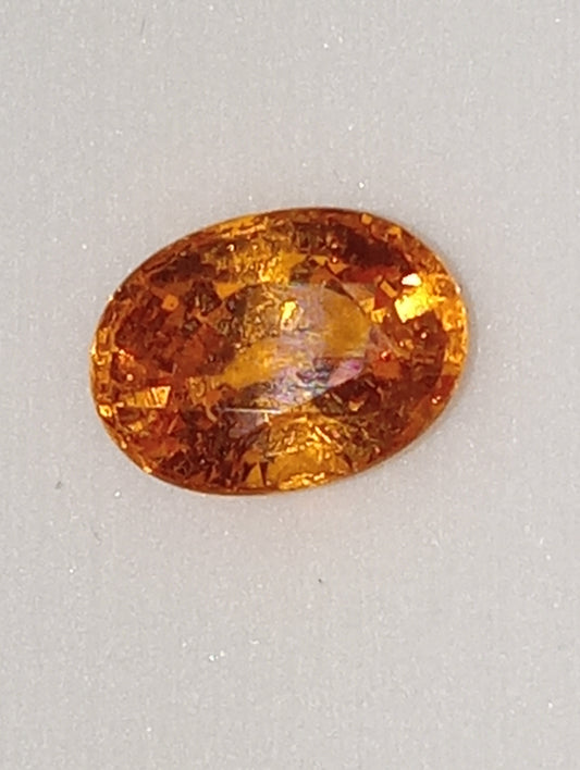 garnet gemstone mandarin spessartite  7mmx5mm oval cut, 1.41ct