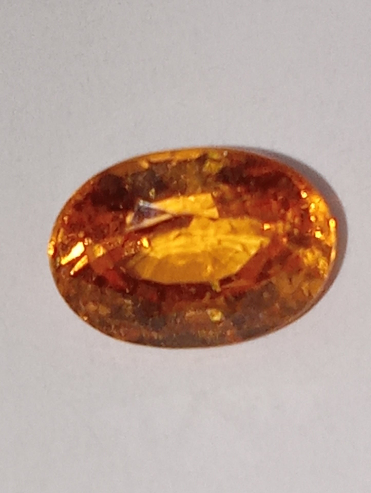 garnet gemstone mandarin spessartite  7mmx5mm oval cut, 1.41ct