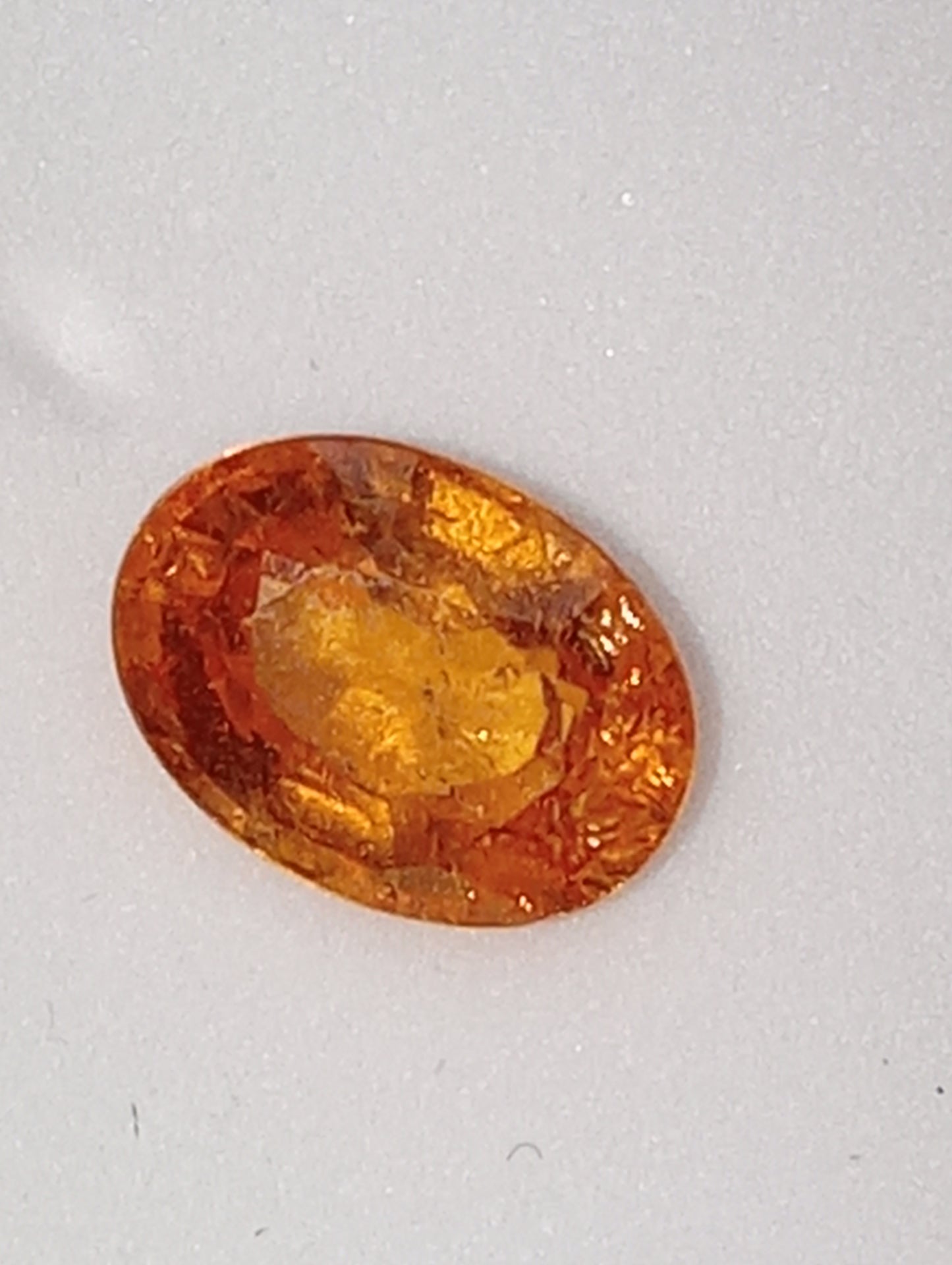 garnet gemstone mandarin spessartite, 7mmx5mm oval cut, 1.26ct