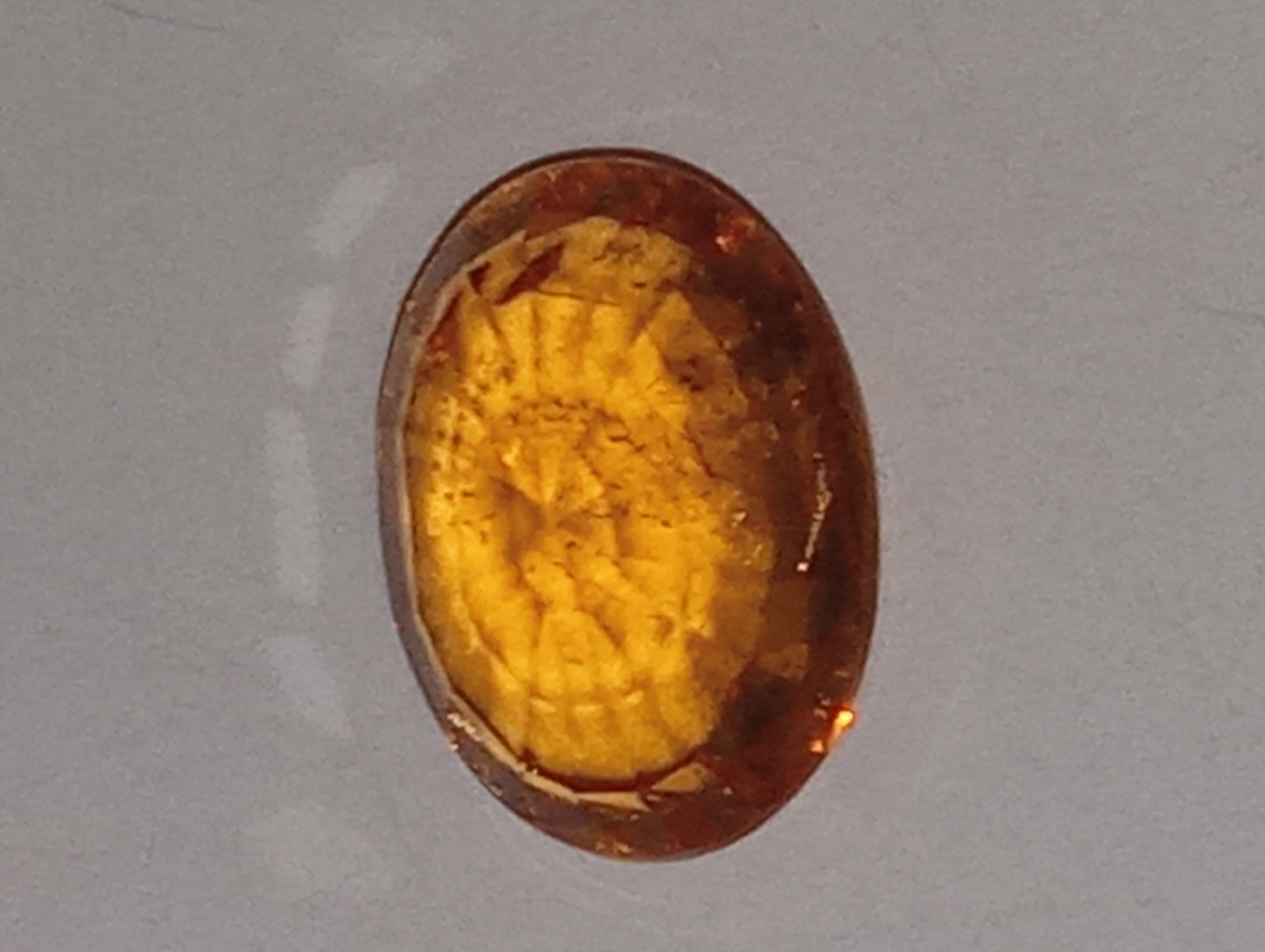 garnet gemstone mandarin spessartite, 7mmx5mm oval cut, 1.26ct