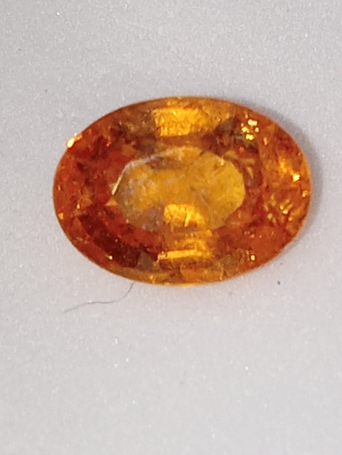 garnet gemstone mandarin spessartite, 7mmx5mm oval cut, 1.26ct