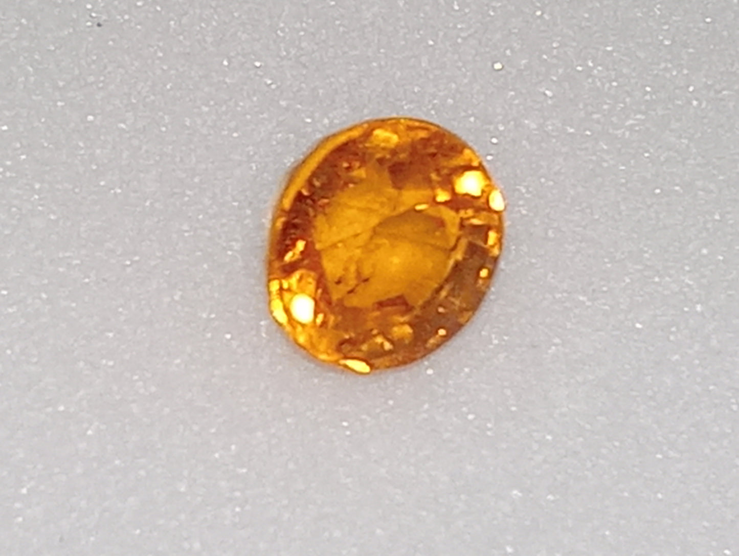 garnet gemstone mandarin spessartite 5mm round cut, .82ct