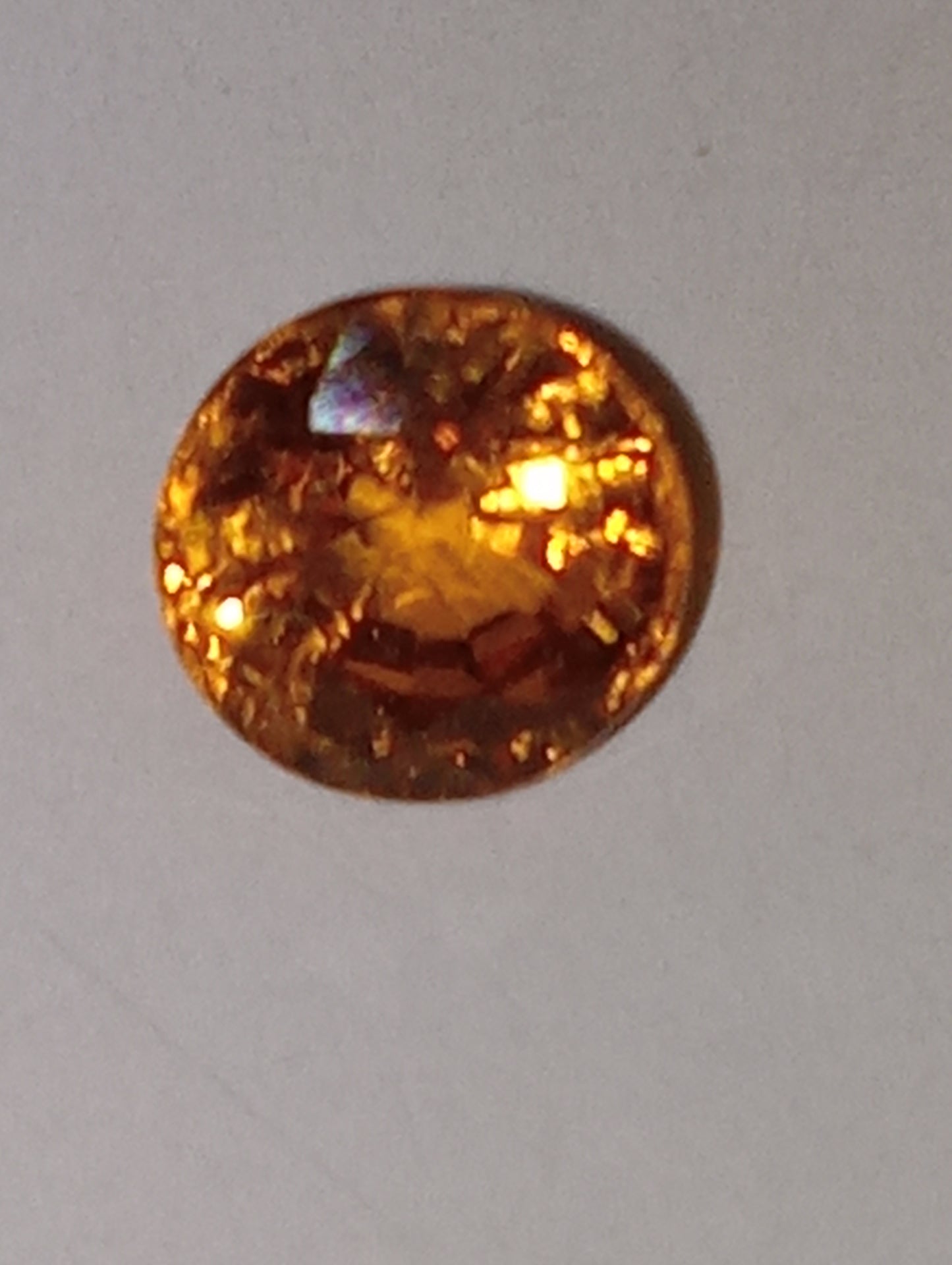 garnet gemstone, mandarin spessartite, 5mm round cut, .81ct