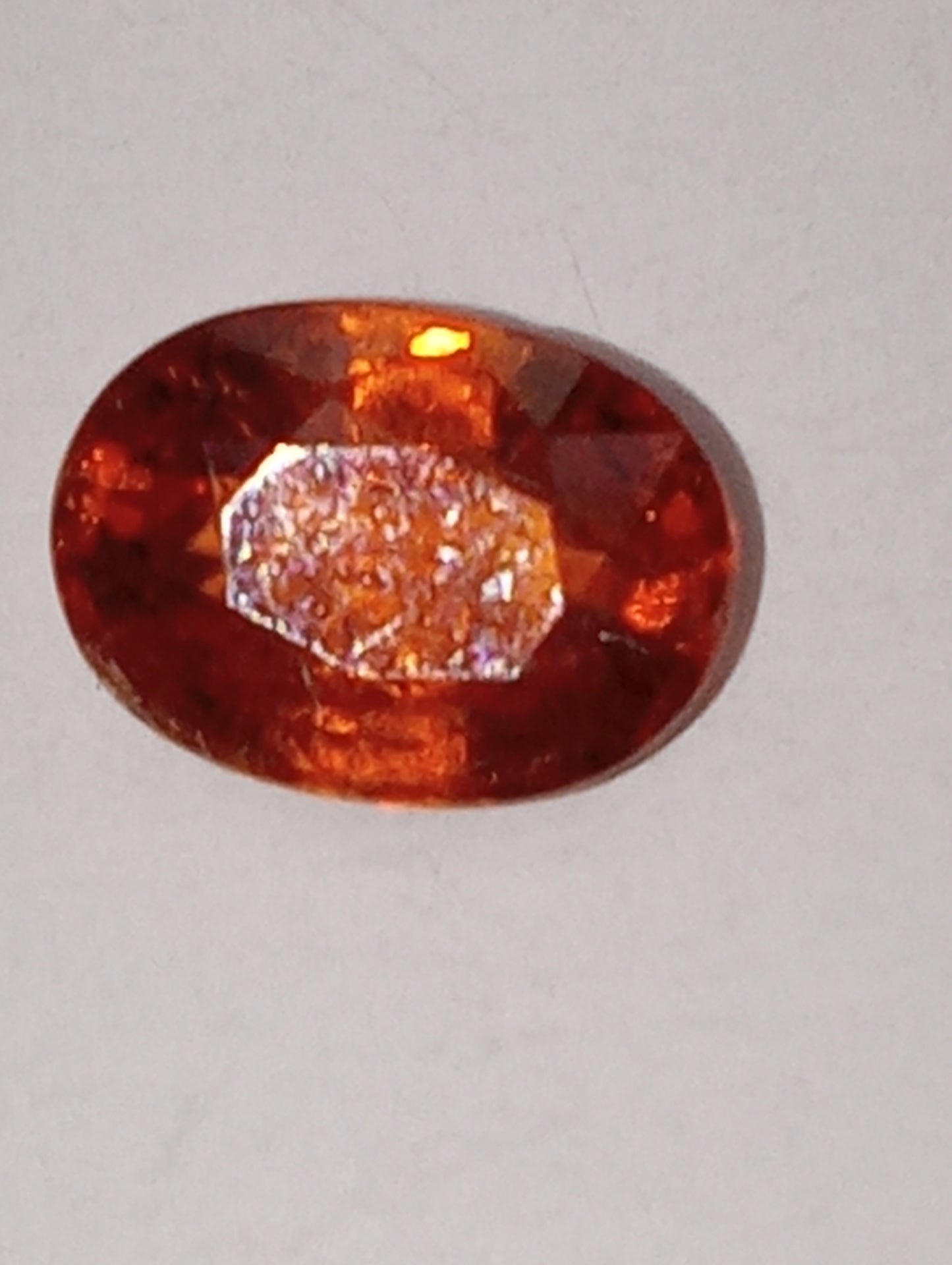 garnet gemstone mandarin spessartite, 7mmx5mm oval cut, 1.13ct