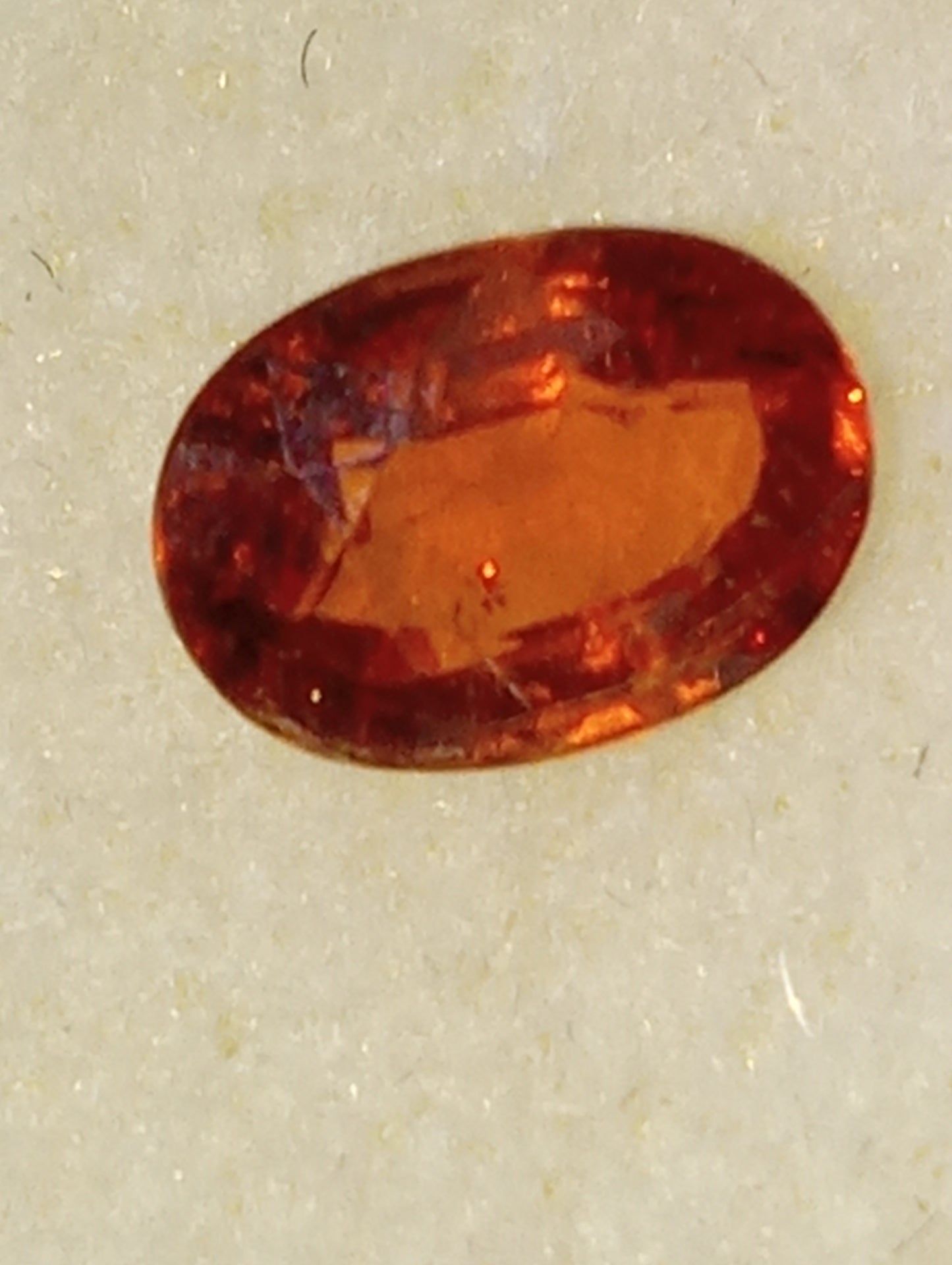 garnet gemstone mandarin spessartite, 7mmx5mm oval cut, 1.13ct