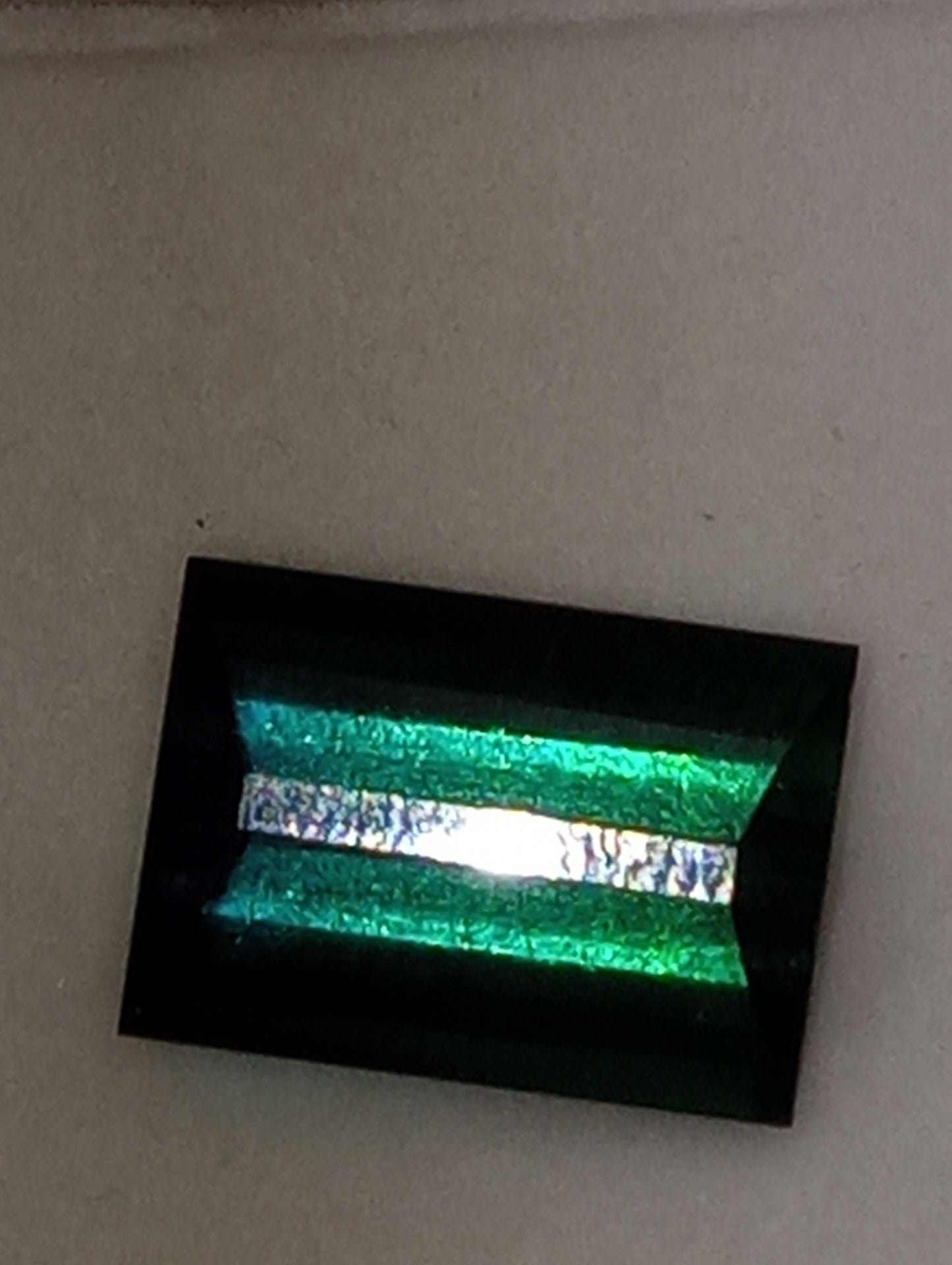 tourmaline gemstone bluish green emerald cut 13x9mm