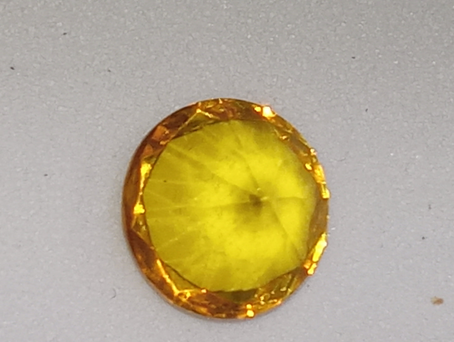 amber Baltic gemstone , yellow,  faceted 8mm round cut, .63ct
