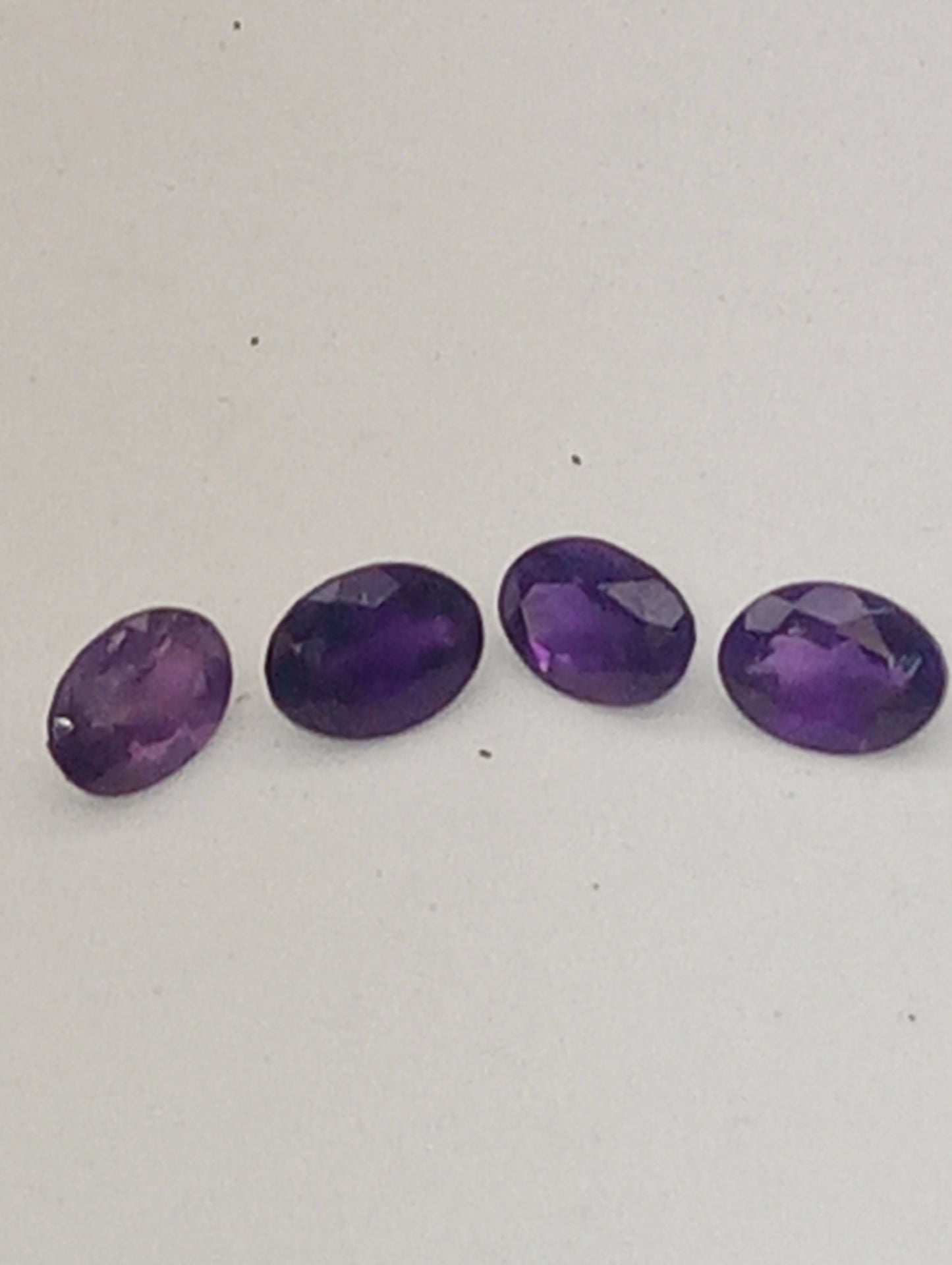 amethyst gemstones ovals 7mmx5mm, 4 stones  dark