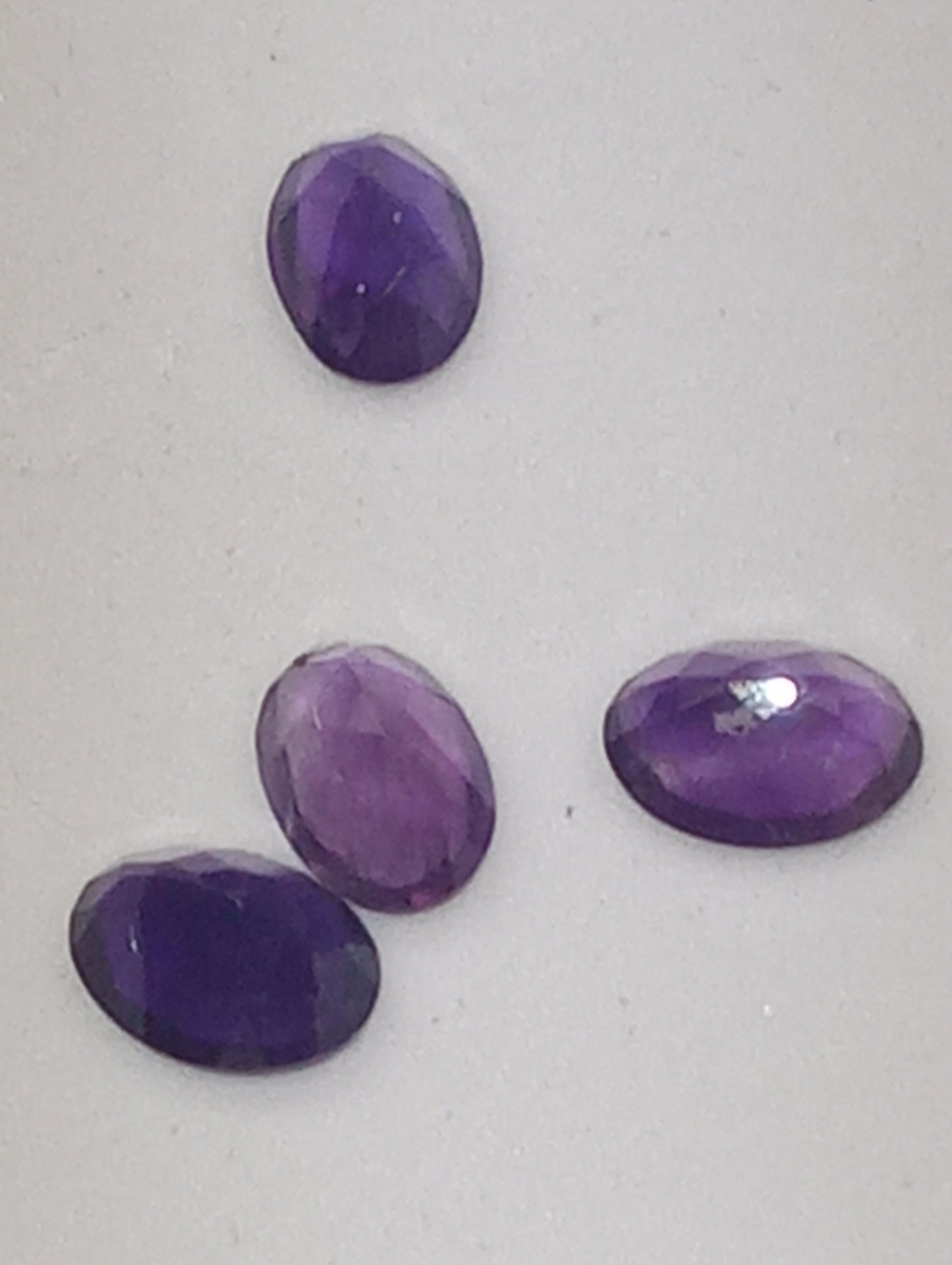 amethyst gemstones ovals 7mmx5mm, 4 stones  dark
