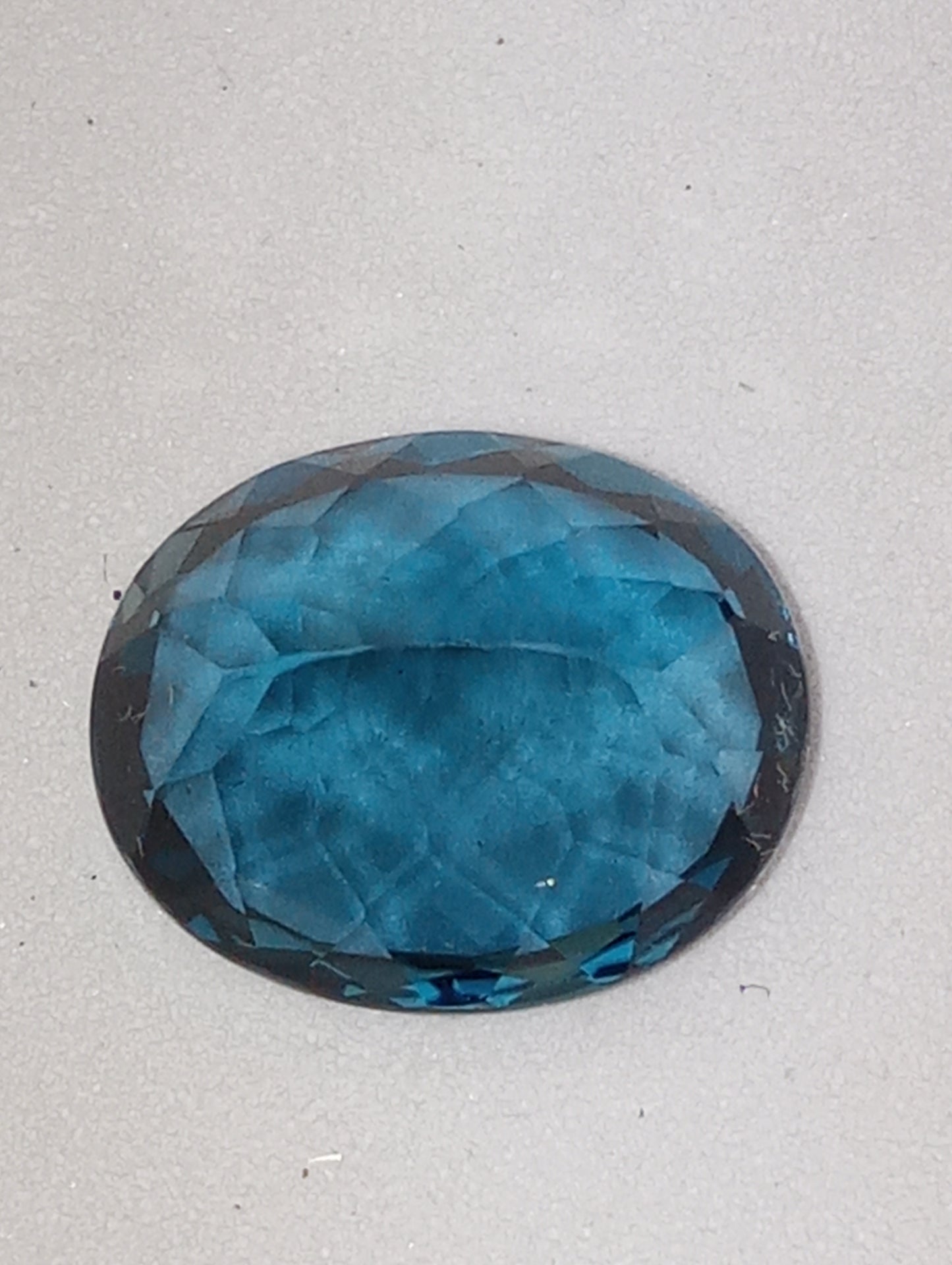 topaz gemstone London blue, 12mmx10mm oval from Sri Lanka