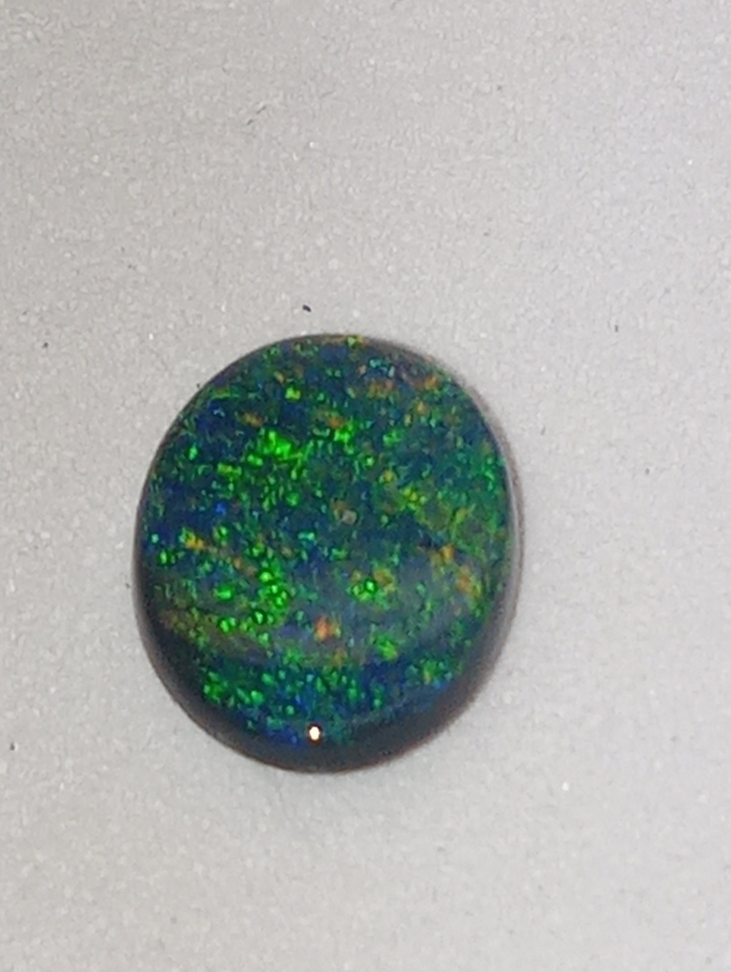 opal gemstone,  black Lightning Ridge .83ct,  8.5mmx6.5mm