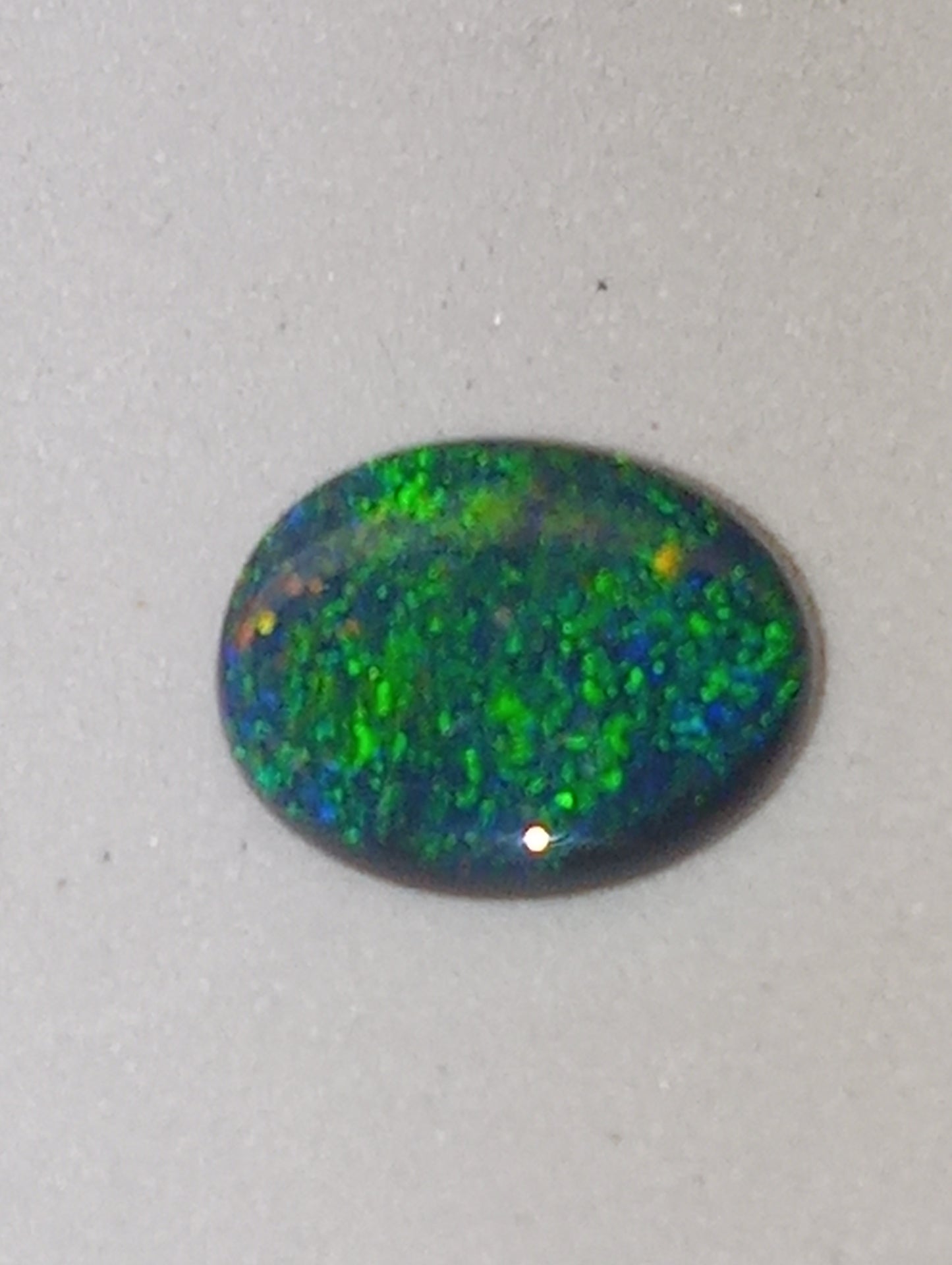 opal gemstone,  black Lightning Ridge .83ct,  8.5mmx6.5mm