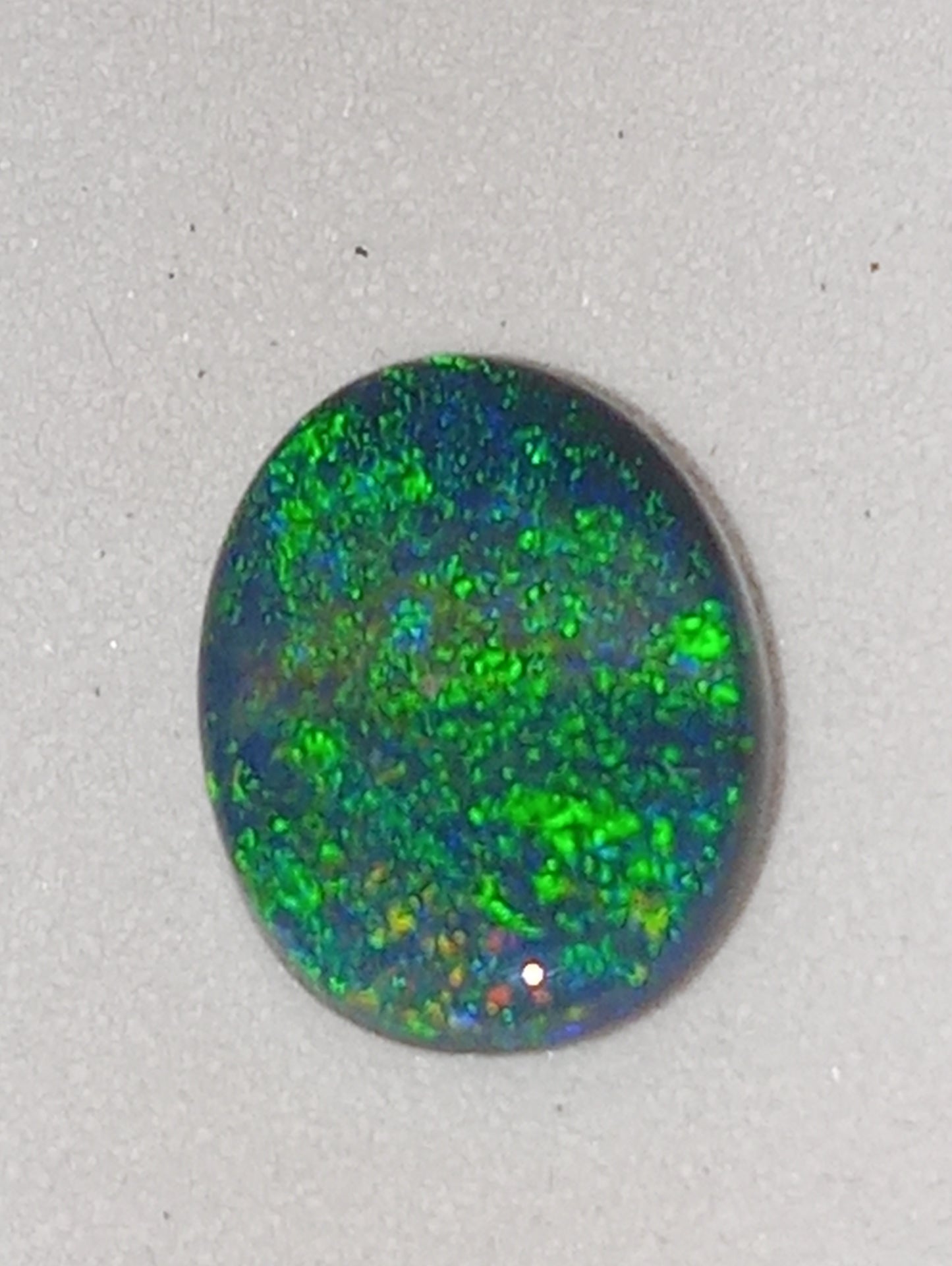opal gemstone,  black Lightning Ridge .83ct,  8.5mmx6.5mm