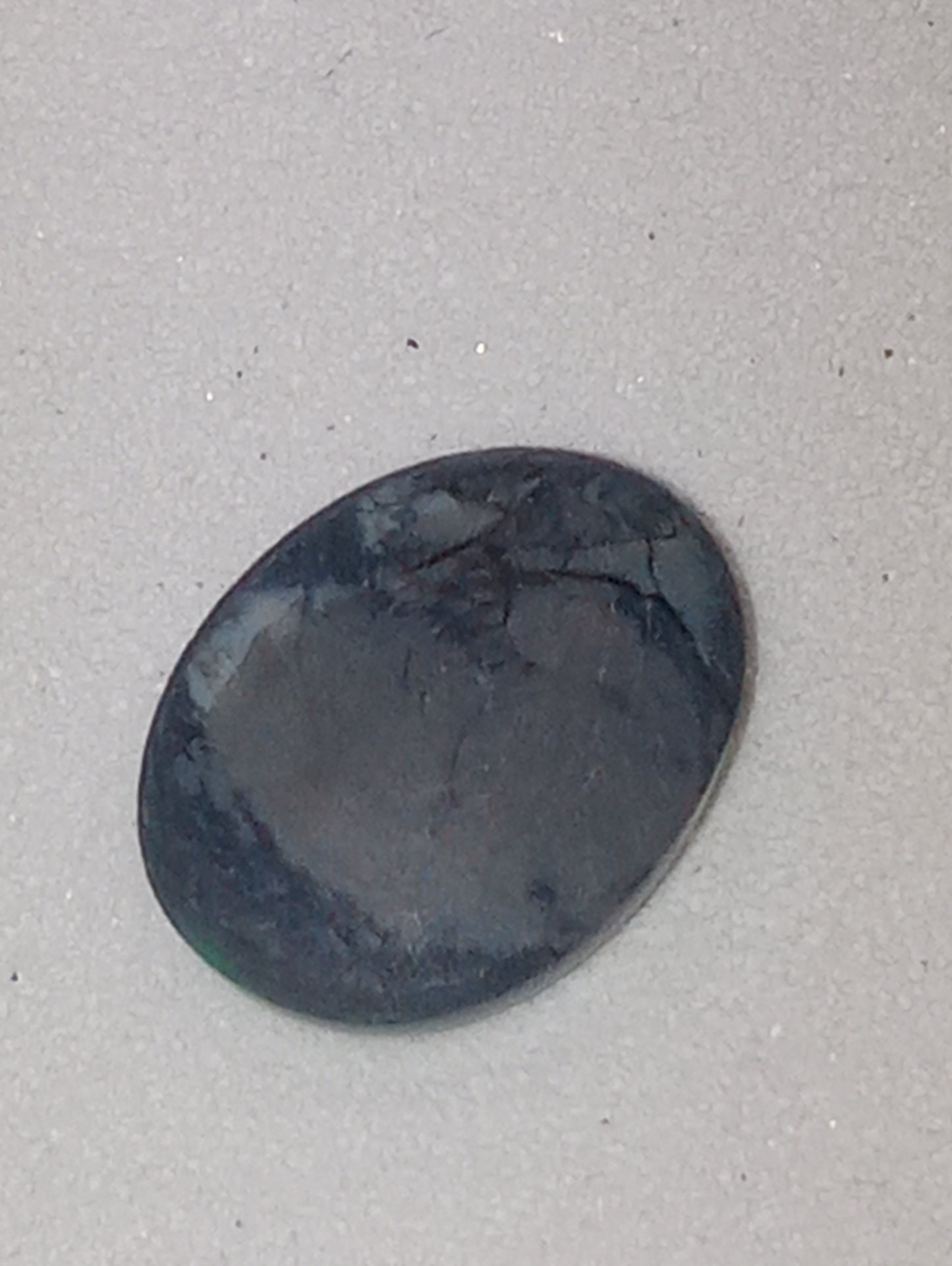 opal gemstone,  black Lightning Ridge .83ct,  8.5mmx6.5mm