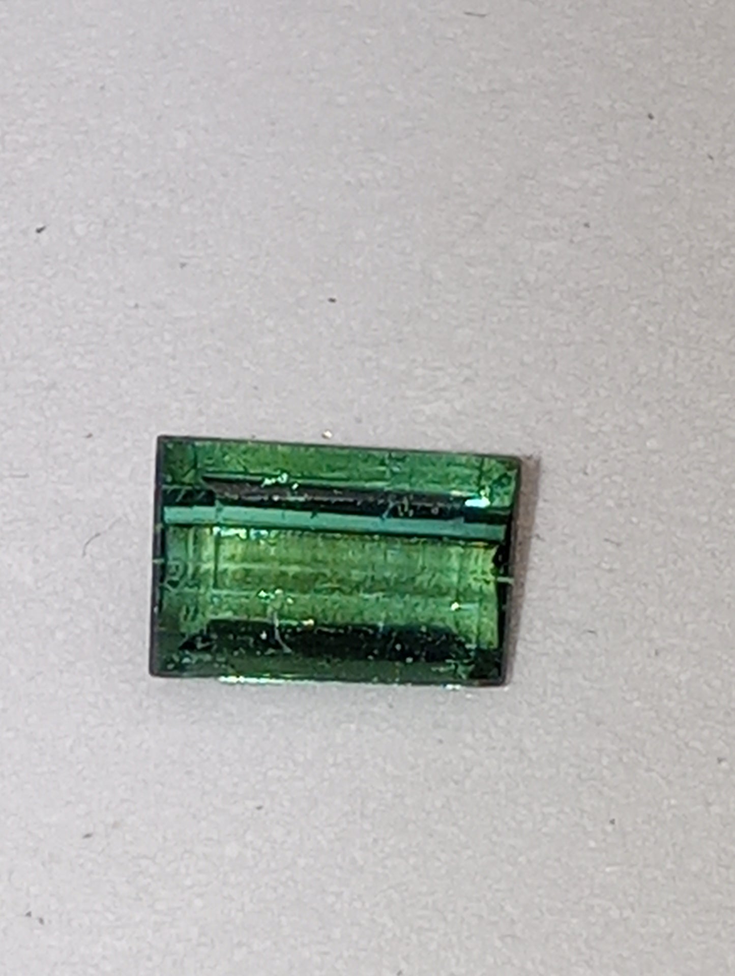 tourmaline gemstone green 6.5mmx4mm emerald cut, .63ct