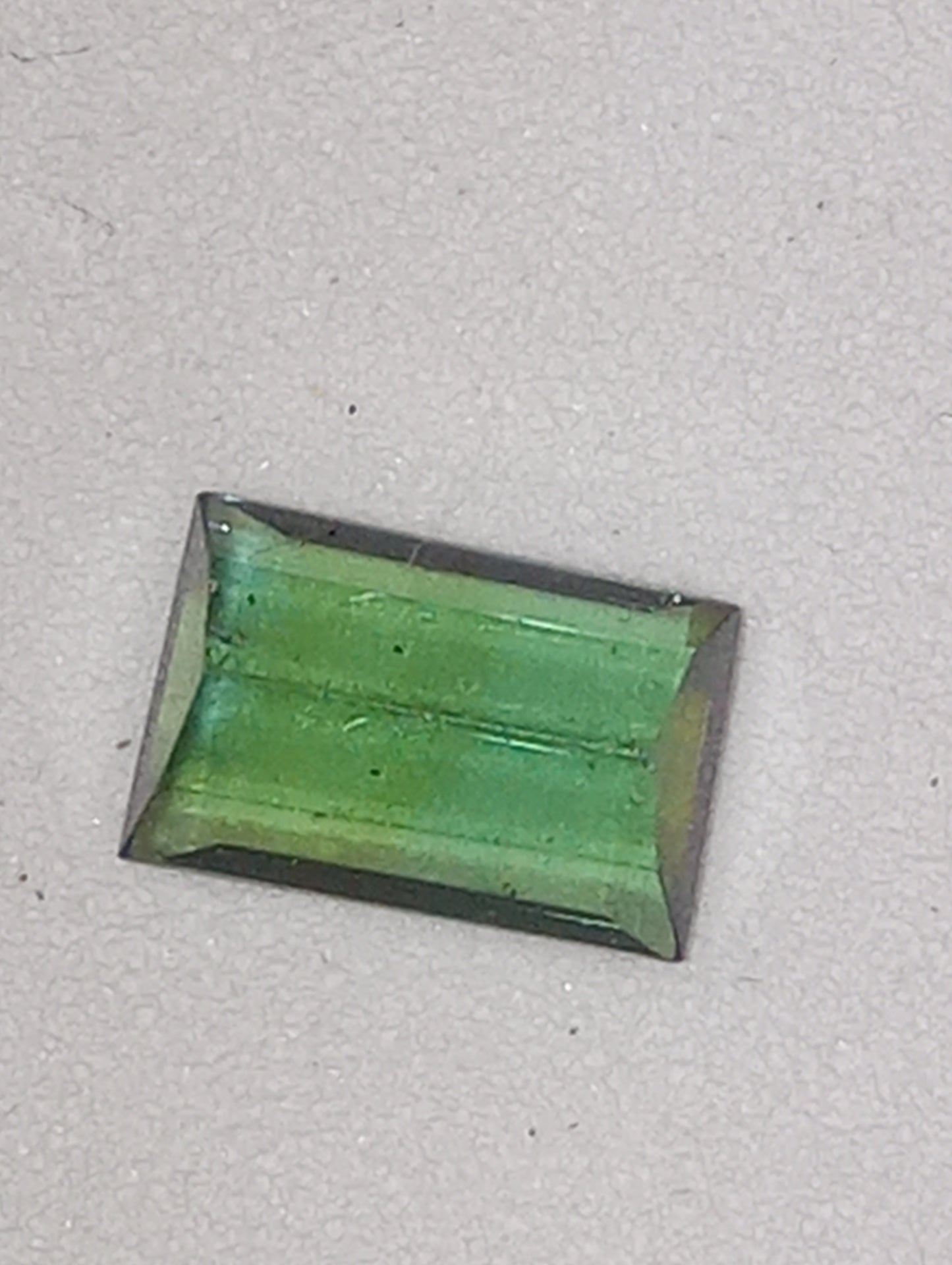 tourmaline gemstone green 6.5mmx4mm emerald cut, .63ct