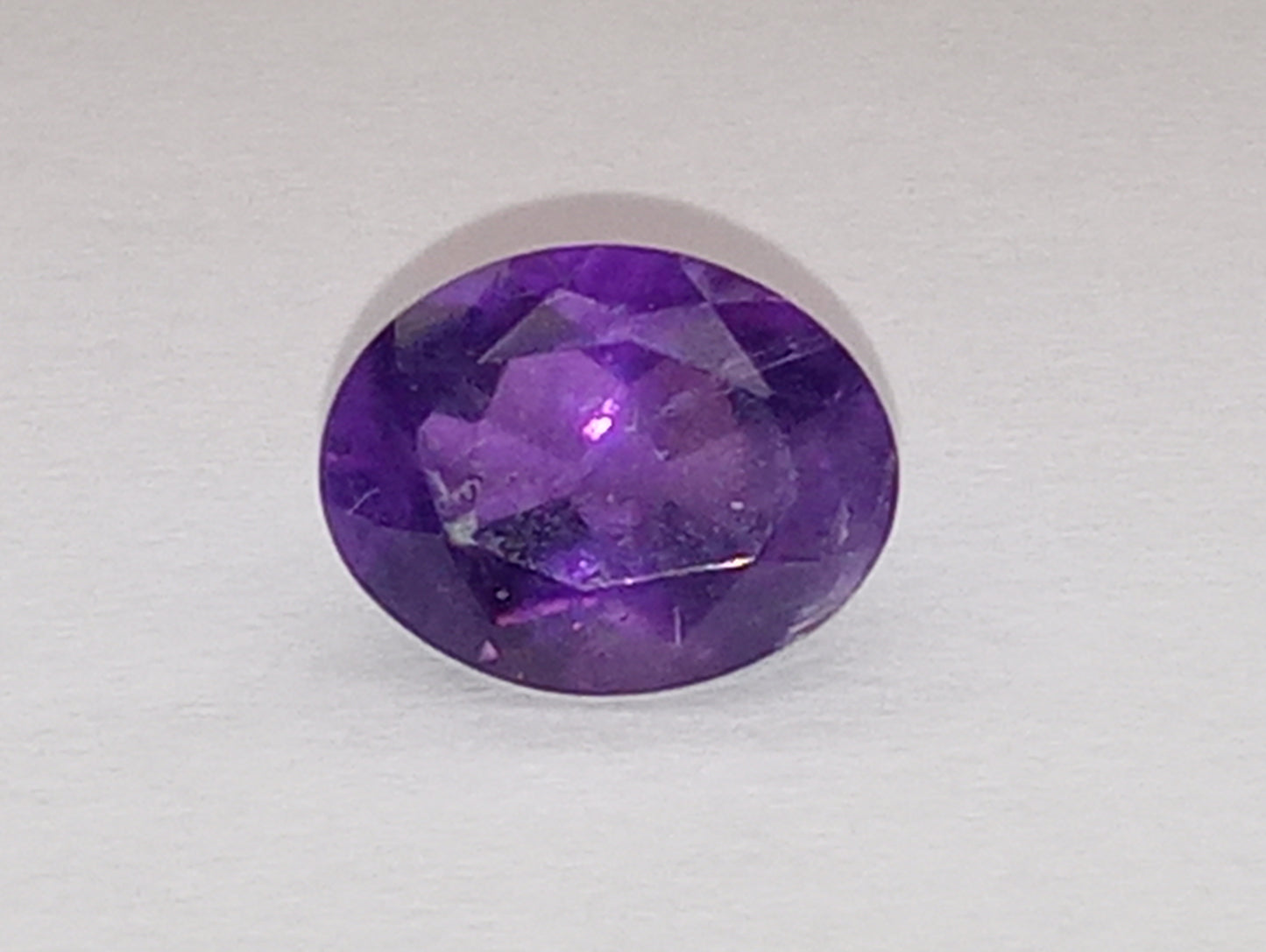 amethyst gemstone, dark, 8mmx6mm oval shape, 1.71ct