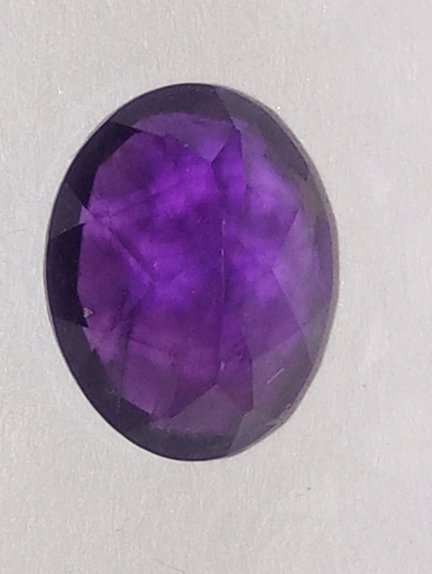 amethyst gemstone, dark, 8mmx6mm oval shape, 1.71ct