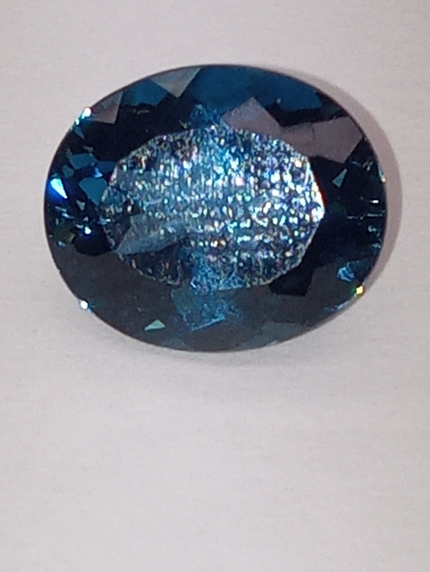 topaz gemstone London blue, 12mmx10mm oval from Sri Lanka