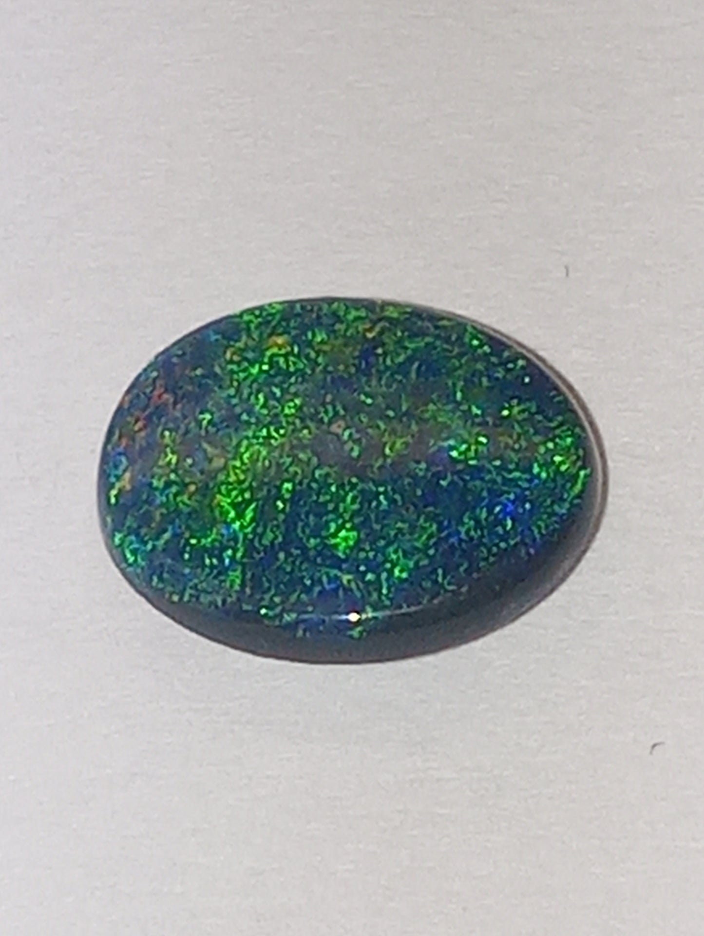 opal gemstone,  black Lightning Ridge .83ct,  8.5mmx6.5mm