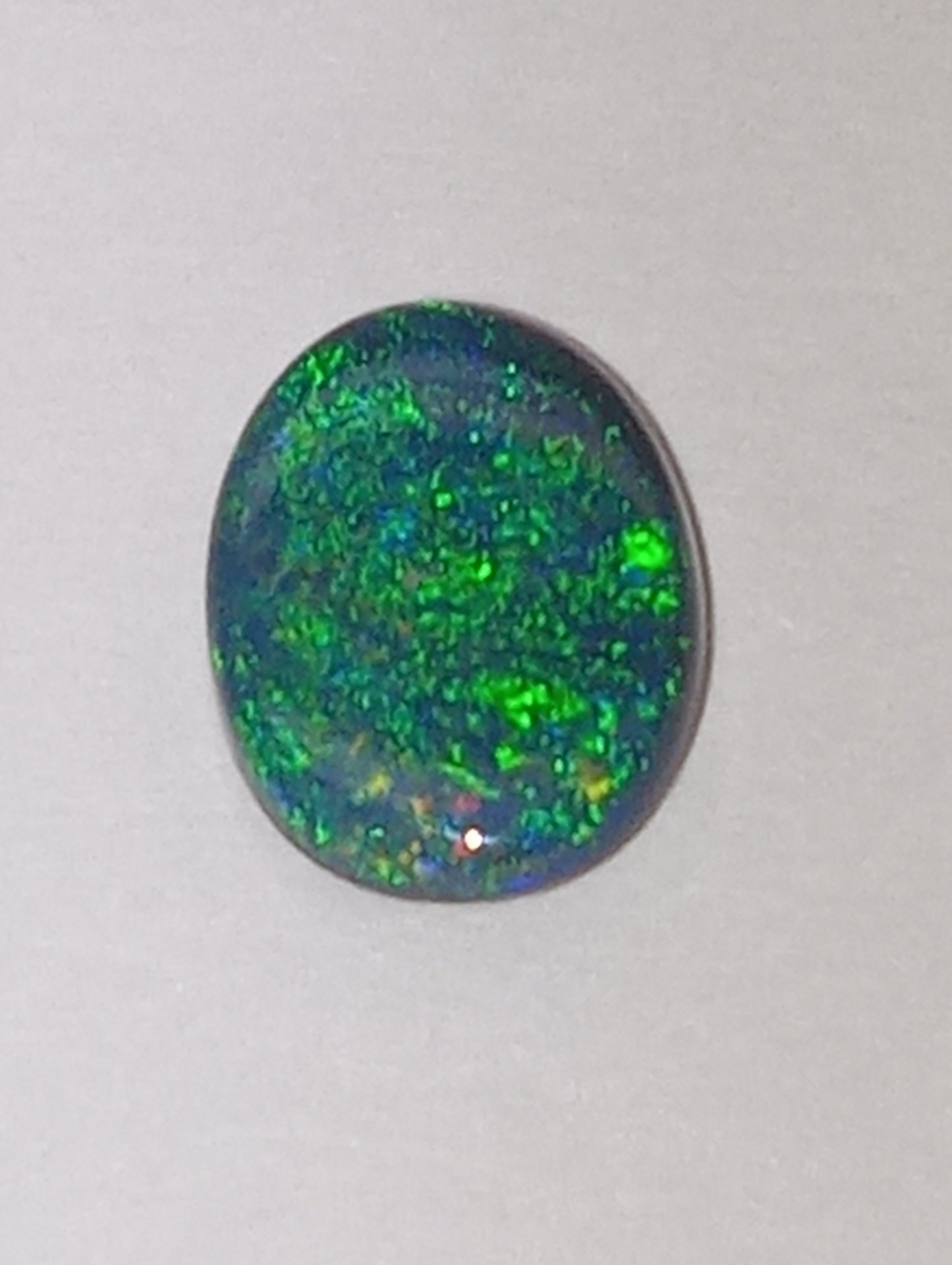 opal gemstone,  black Lightning Ridge .83ct,  8.5mmx6.5mm